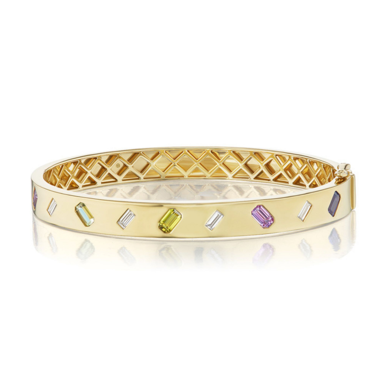 The Mixed Shape Diamond and Multicolor Sapphire Bangle showcases a geometric lattice interior and is adorned with vibrant sapphires of various cuts set diagonally along its sleek gold exterior.