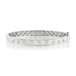 Presenting the Burnish Set Mixed Shape Diamond Bangle, crafted in 18K gold and adorned with an array of mixed shape diamonds encircling the band, showcasing an intricately designed lattice pattern on the inner side.