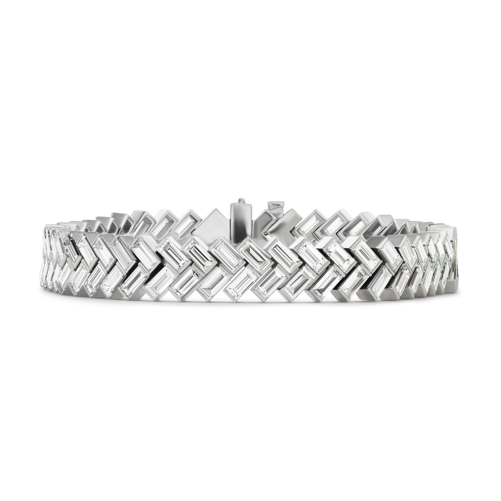 Introducing the Half-Bezel Set Chevron Diamond Tennis Bracelet in White Gold—a stunning piece featuring a sleek, modern chevron pattern crafted from luminous white gold. Rectangular links are arranged in a repeating zigzag design, their polished and reflective surfaces creating an elegant shine. Rows of baguette diamonds accent each link, adding sophisticated brilliance and elevating this bracelet’s refined aesthetic.