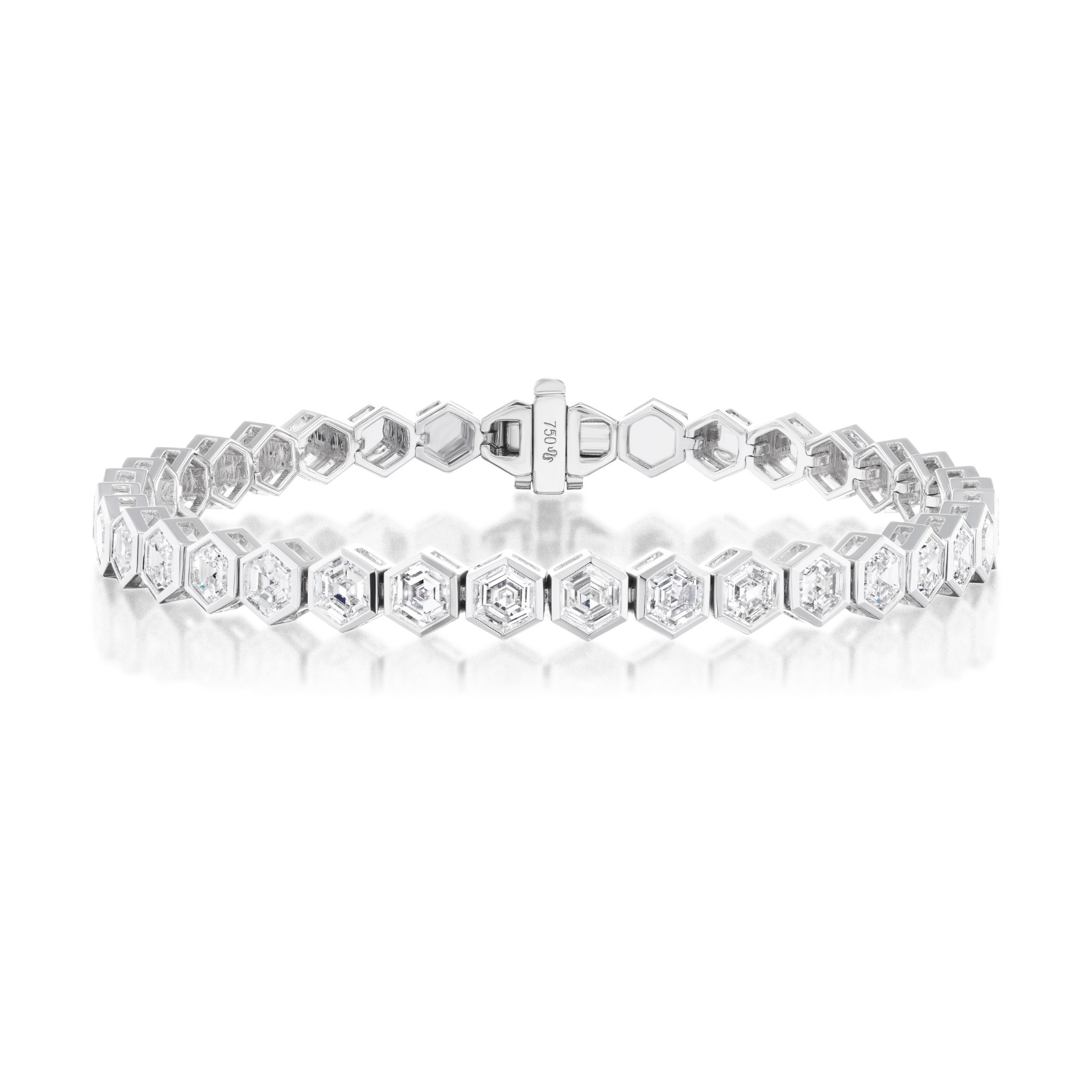 The Medium Hexagon Bezel Set Diamond Tennis Bracelet in White Gold features hexagonal links, each set with a square-cut diamond, and is displayed against a white background.