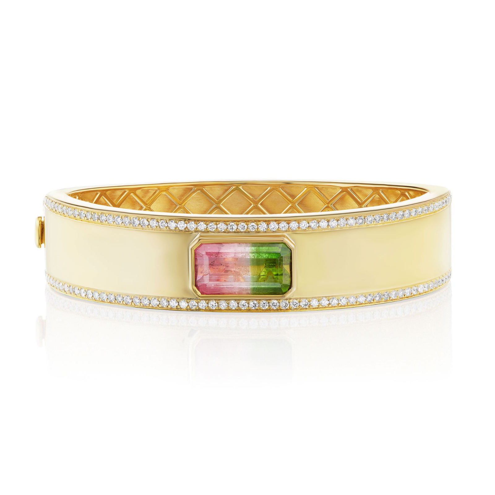 The East-West Set Tourmaline Bangle with Pavé Trim in Yellow Gold showcases an exquisite 18K yellow gold design, featuring a rectangular emerald-cut pink and green tourmaline at its center, framed by pavé-set white diamonds.