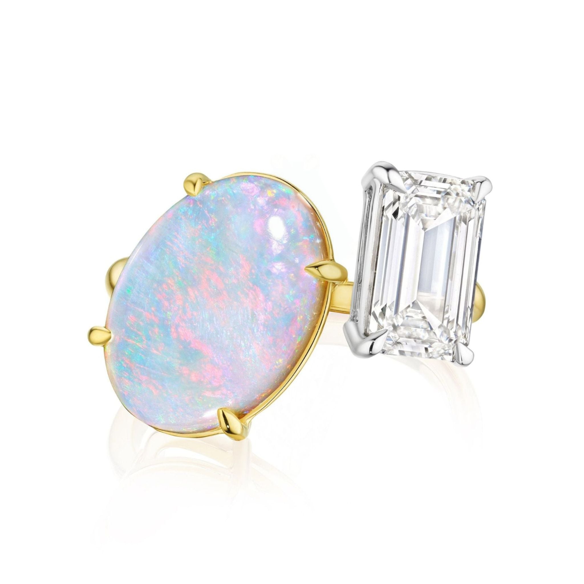 The Toi et Moi Opal and Diamond Ring in Yellow Gold showcases an oval opal set in 18K yellow gold next to an emerald-cut diamond in white metal, displayed against a white background.