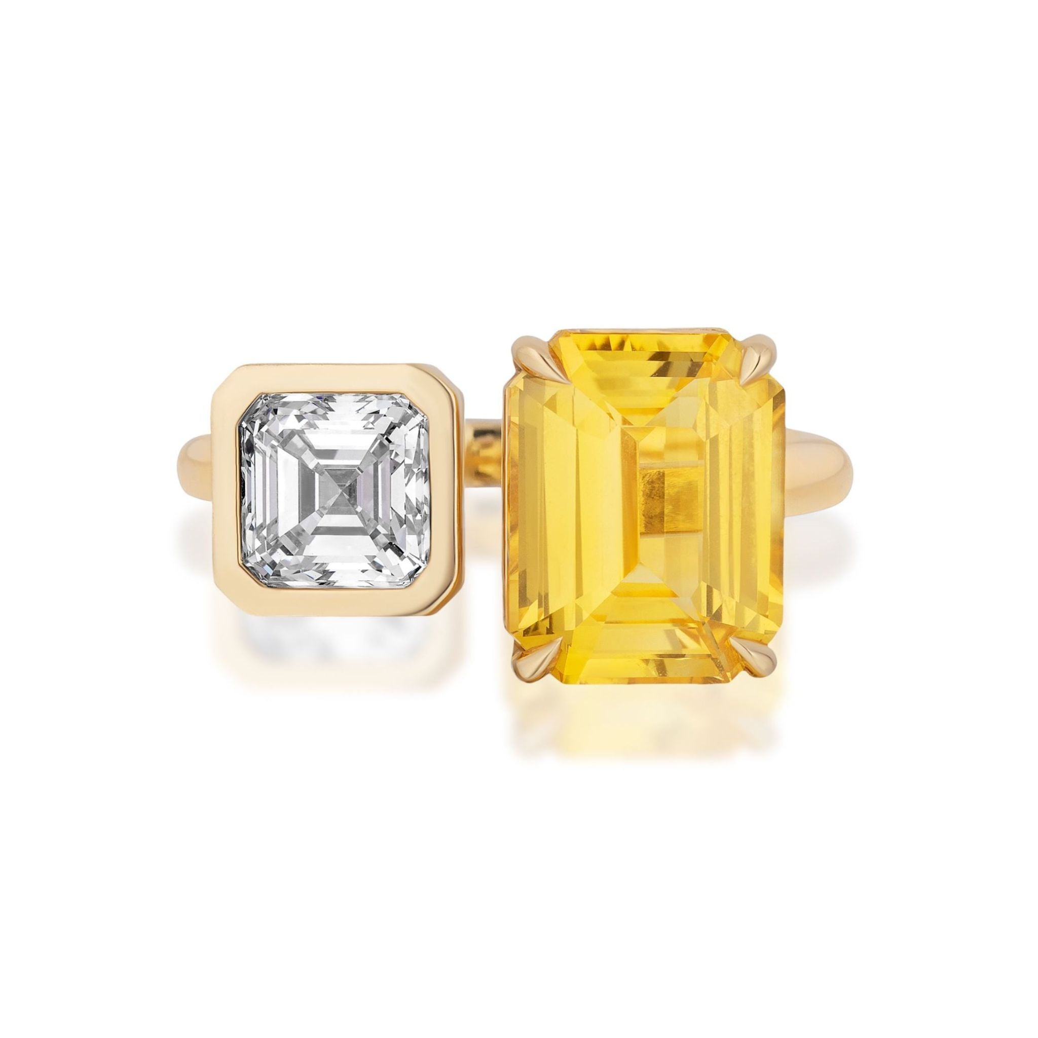 The Toi et Moi Ring with Asscher Cut and Emerald Cut Diamonds in Yellow Gold showcases a modern, open design featuring two side-by-side stones: a clear Asscher cut diamond beside a larger rectangular fancy yellow emerald cut diamond.