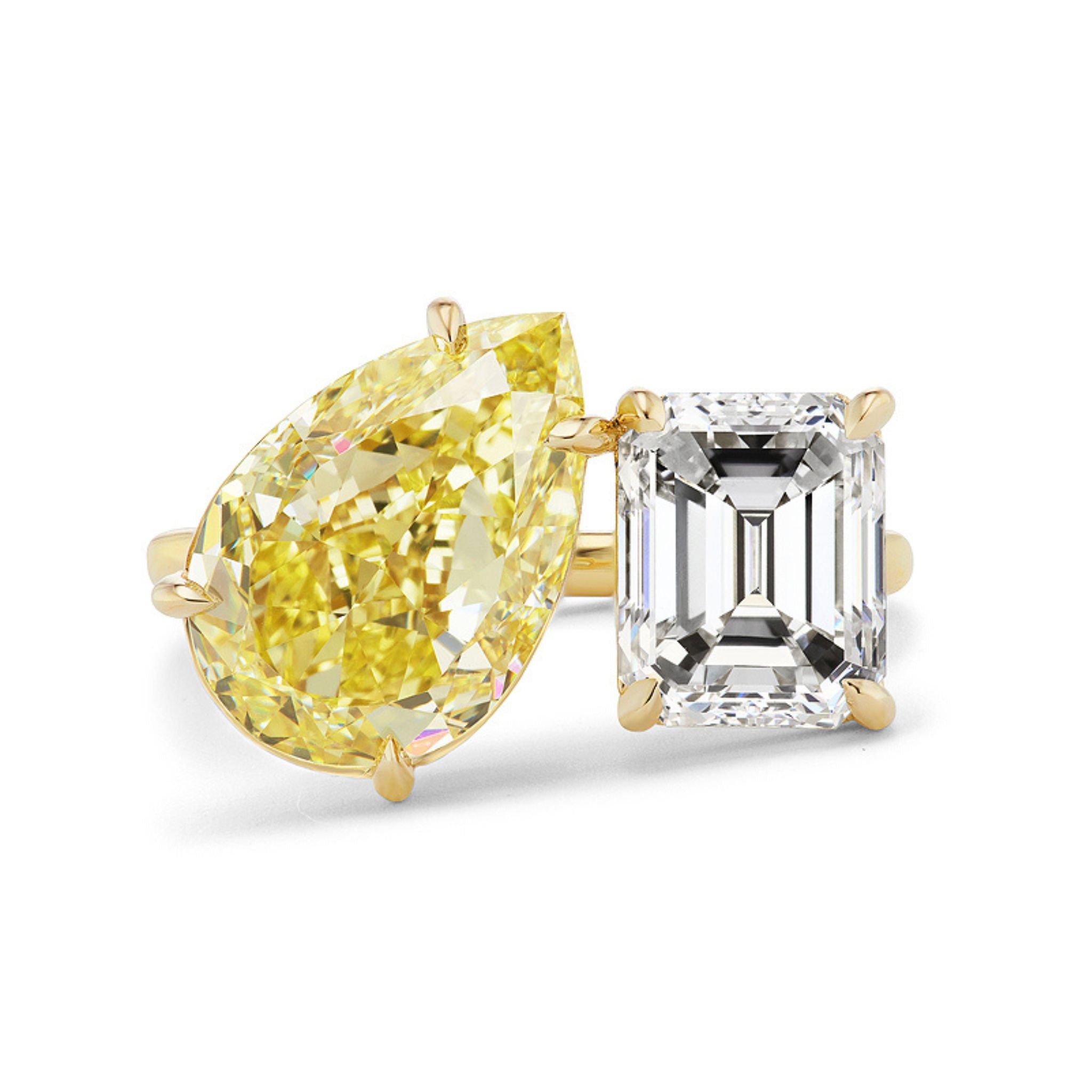 The Toi et Moi Ring features a fancy yellow pear-shaped diamond paired with a white emerald-cut diamond, set side by side in prongs—a bespoke gold piece perfect for celebrating life’s special moments.