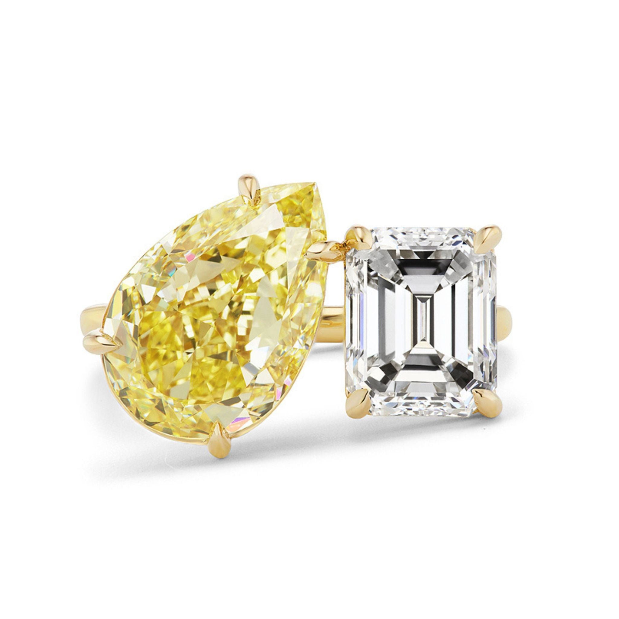The Toi et Moi Ring features a fancy yellow pear diamond paired with a white emerald cut diamond, set side by side—an elegant choice for modern bridal or celebration rings.