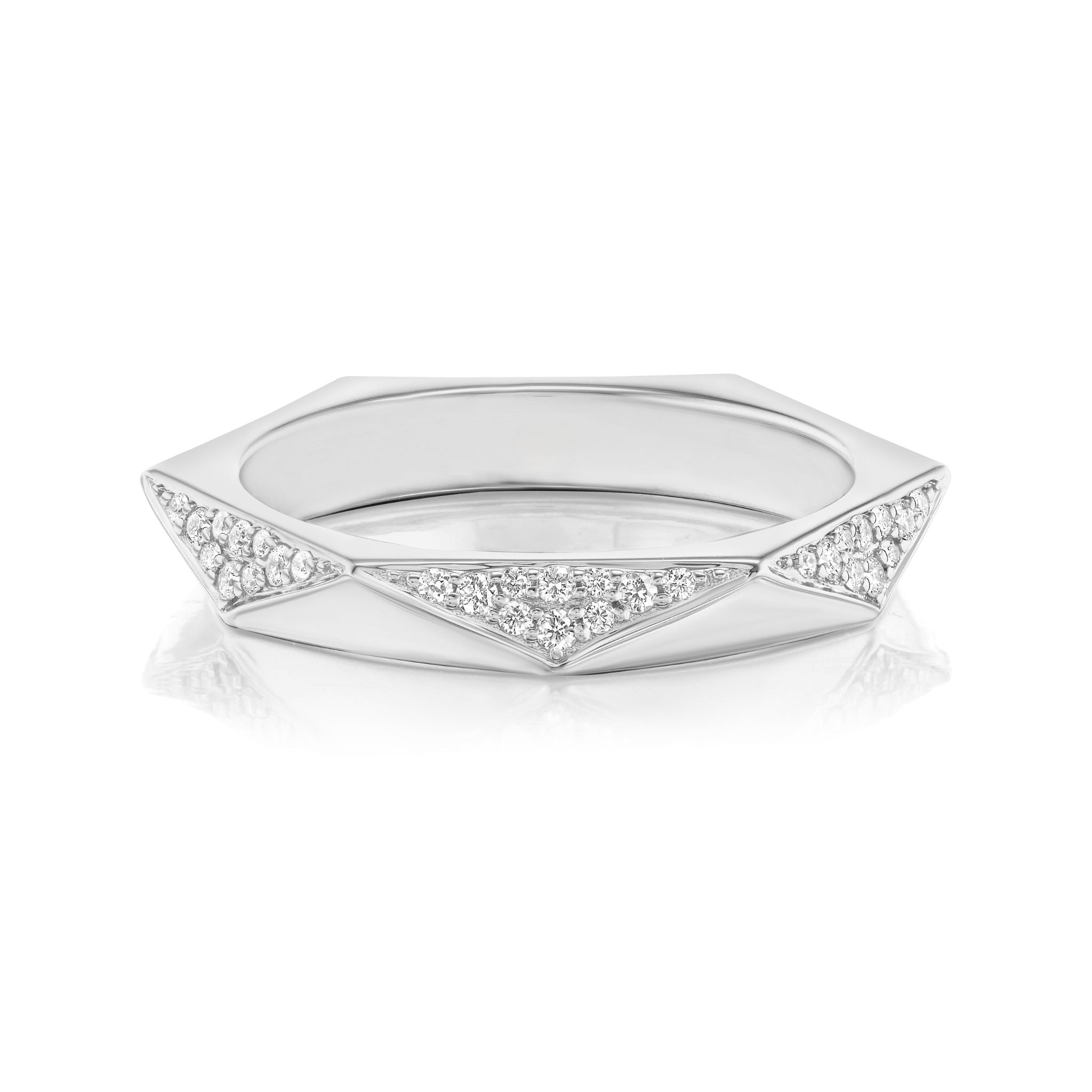 The Triangular Geometric Pavé Band is a silver ring with faceted, angled surfaces adorned with clusters of small white gemstones, featuring a modern angular shape for a contemporary look.