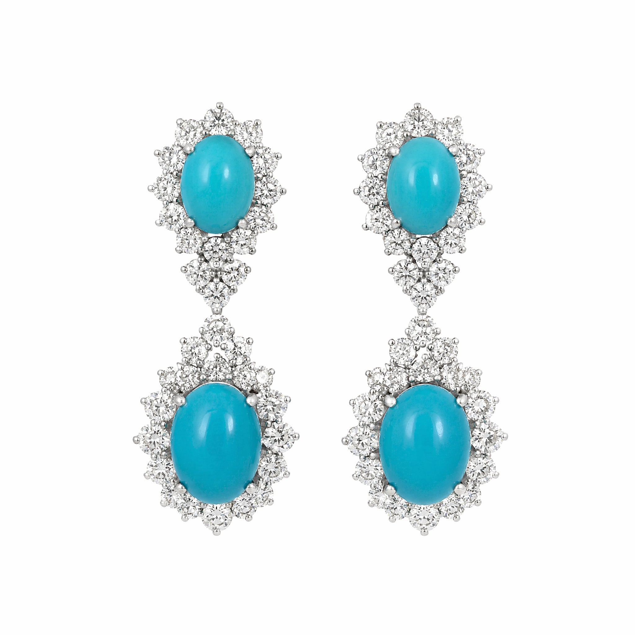 A pair of Turquoise and Diamond Earclips with two oval turquoise cabochons surrounded by sparkling diamonds, set in 14K white gold, shown against a white background.
