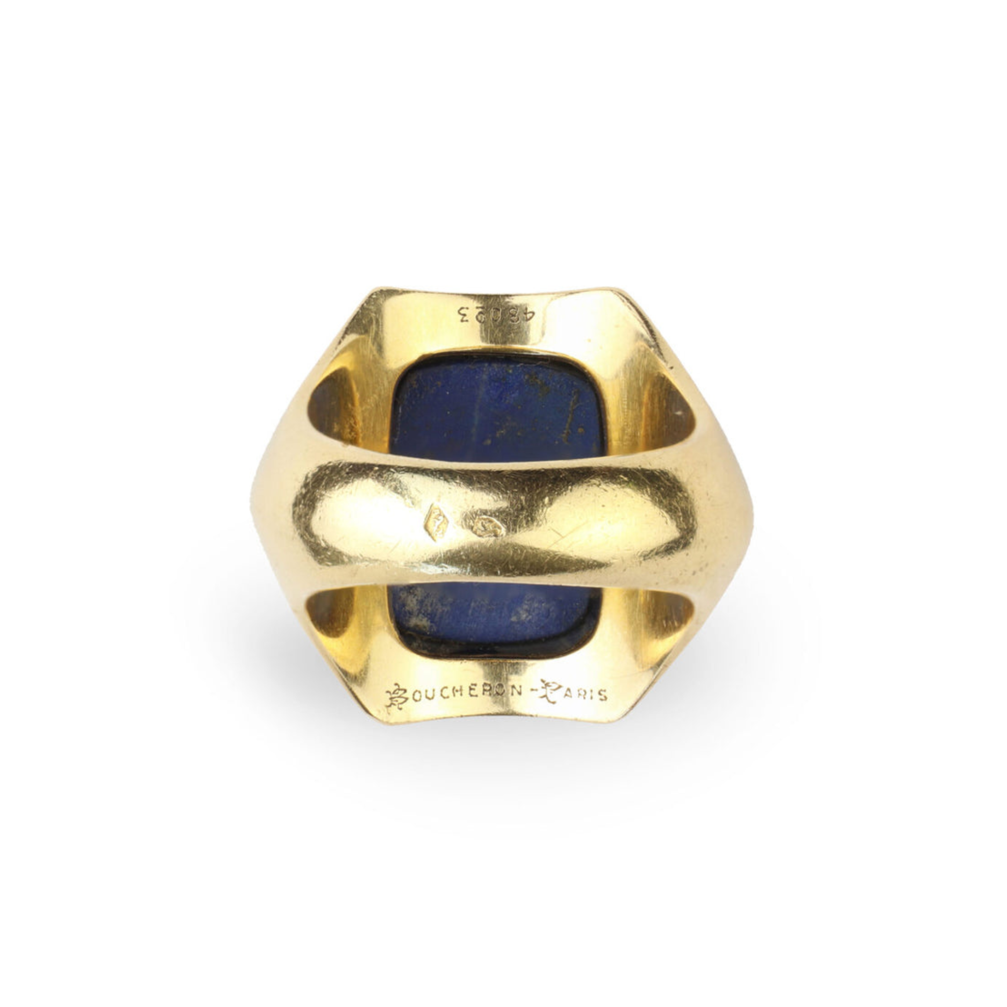 The Boucheron Lapis Lazuli and Gold Ring features a bold geometric design with a large rectangular blue lapis stone set in 18 karat gold and "BOUCHERON PARIS" engraved inside the band.