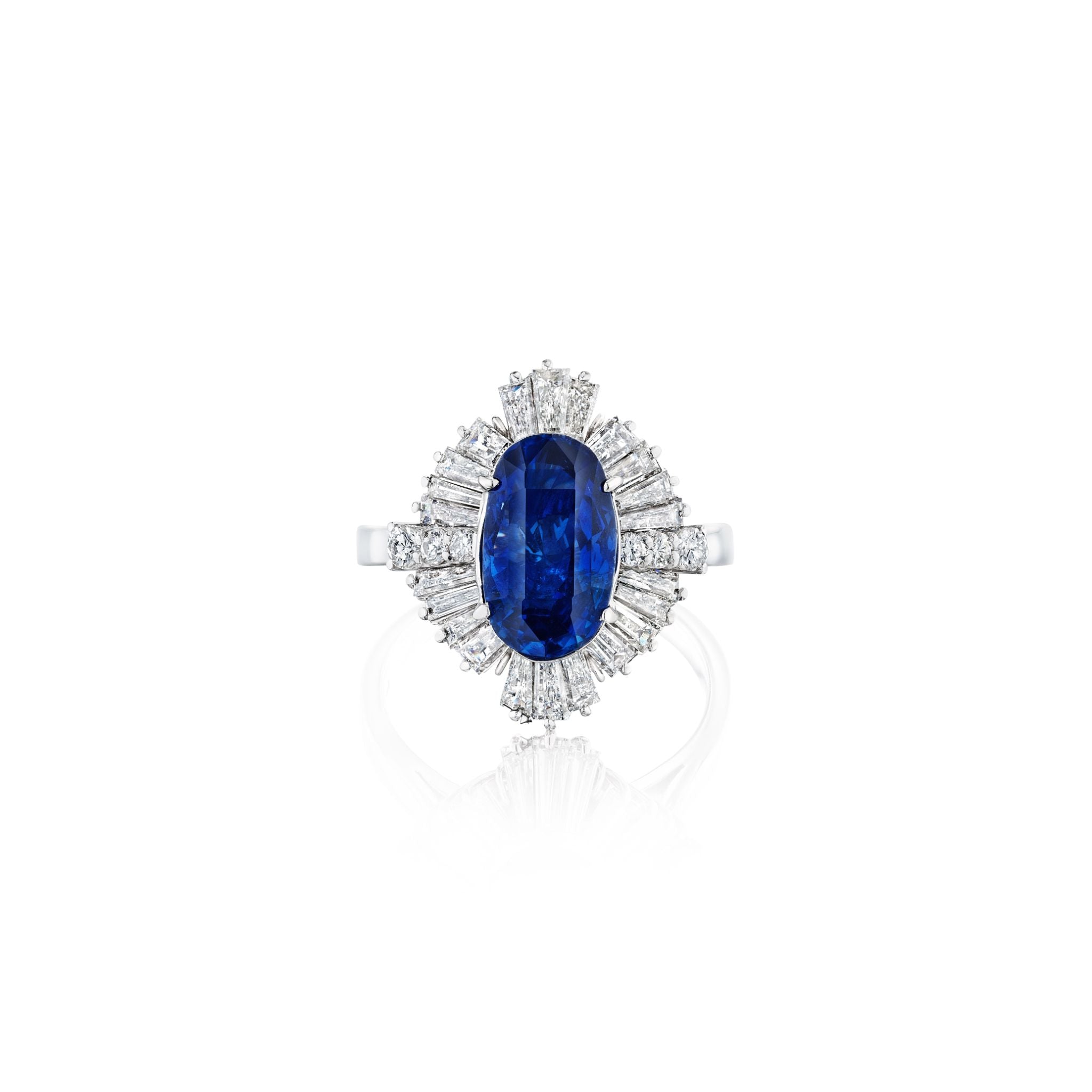 The Sapphire and Diamond Ring features a large oval Ceylon sapphire at the center, encircled by small diamonds in a sunburst halo on a platinum band. Includes a GIA report for assurance.