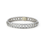 The Cartier Mid-Century Diamond Bracelet features a vintage-inspired double row of sparkling round-cut diamonds in silver with a gold box clasp, reminiscent of classic Cartier style, displayed against a white background.