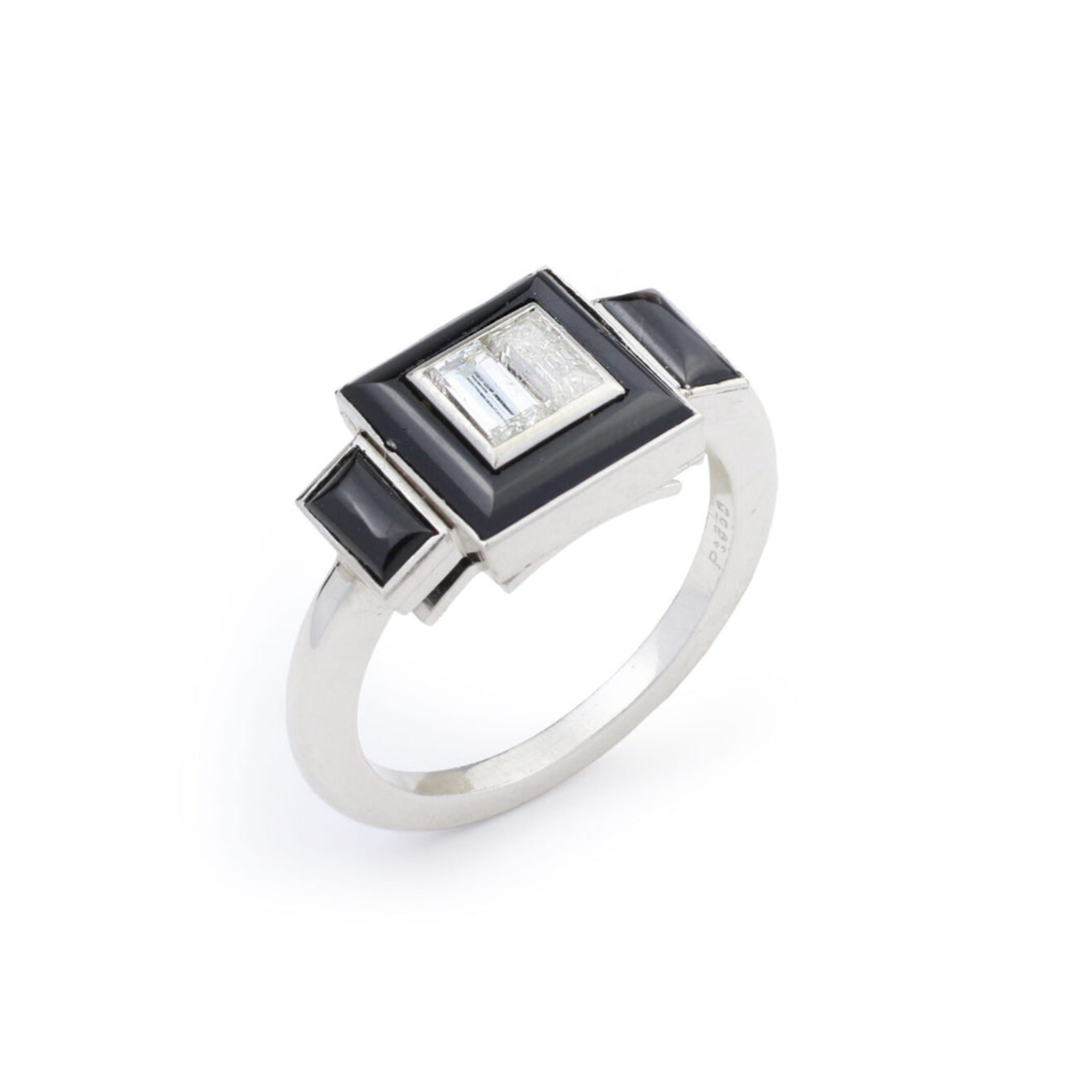 The Onyx and Diamond Ring features a platinum band with a rectangular center set with a diamond, framed by black onyx accents, all displayed on a white background.