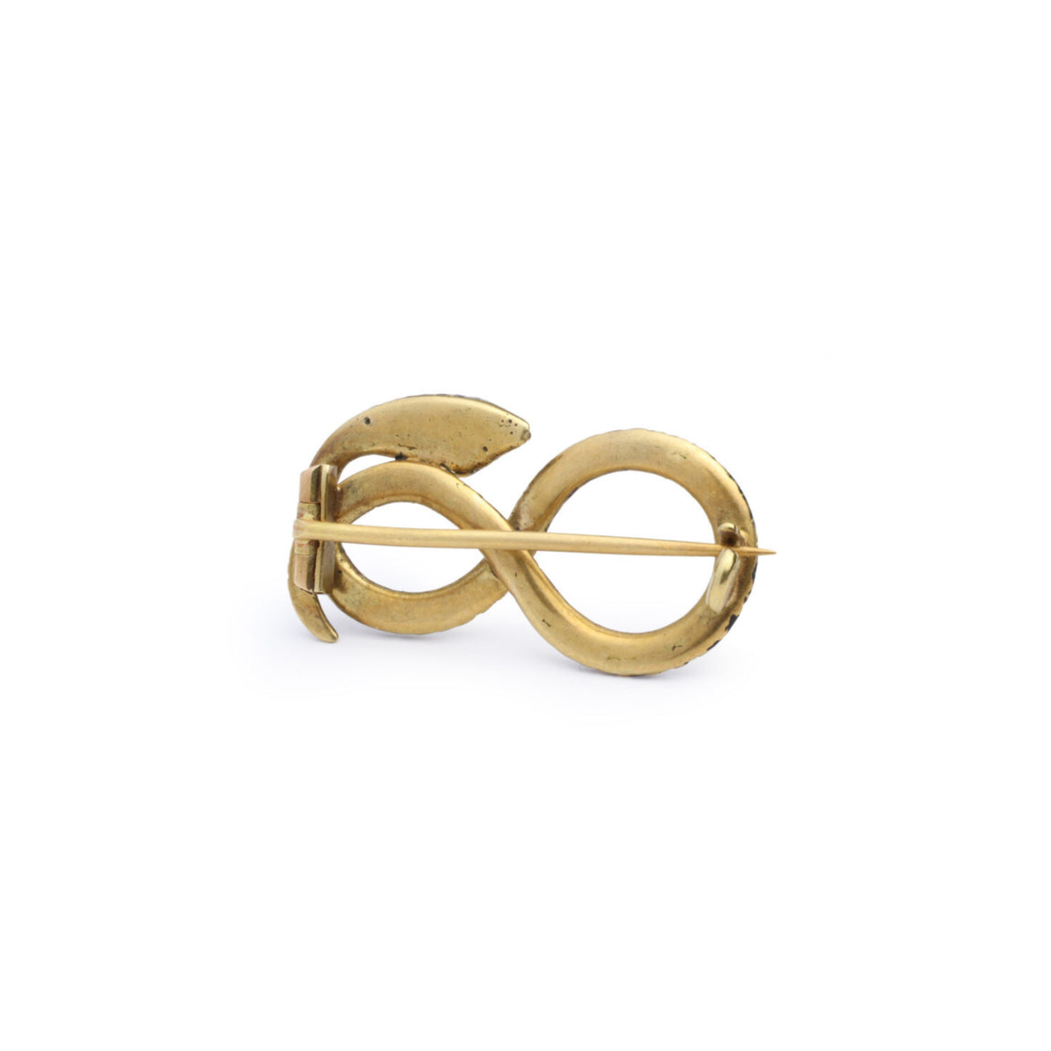 The Antique Diamond and Enamel Snake Pin features an abstract infinity design with smooth, rounded curves. Inspired by vintage snake motifs, its pointed pin fastener and minimalist style add a modern touch to this classic jewel.