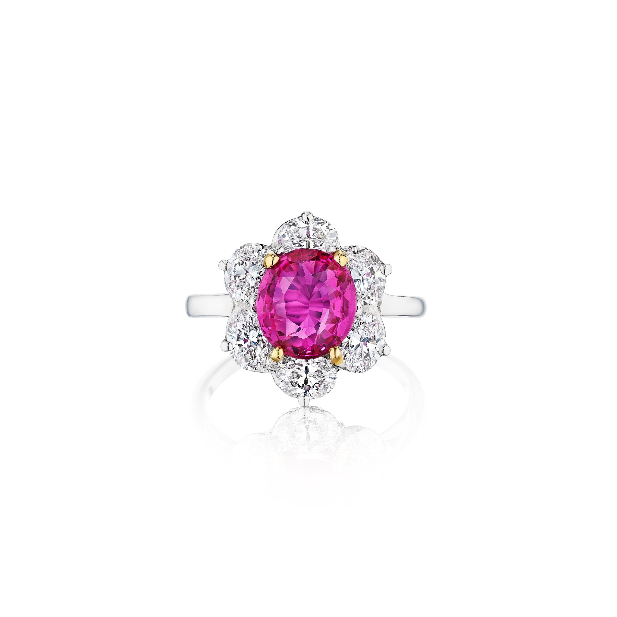 The Oscar Heyman & Brothers Pink Sapphire and Diamond Ring showcases a large oval Ceylon pink sapphire encircled by round white diamonds in a floral design, set in platinum and white gold against a white background.
