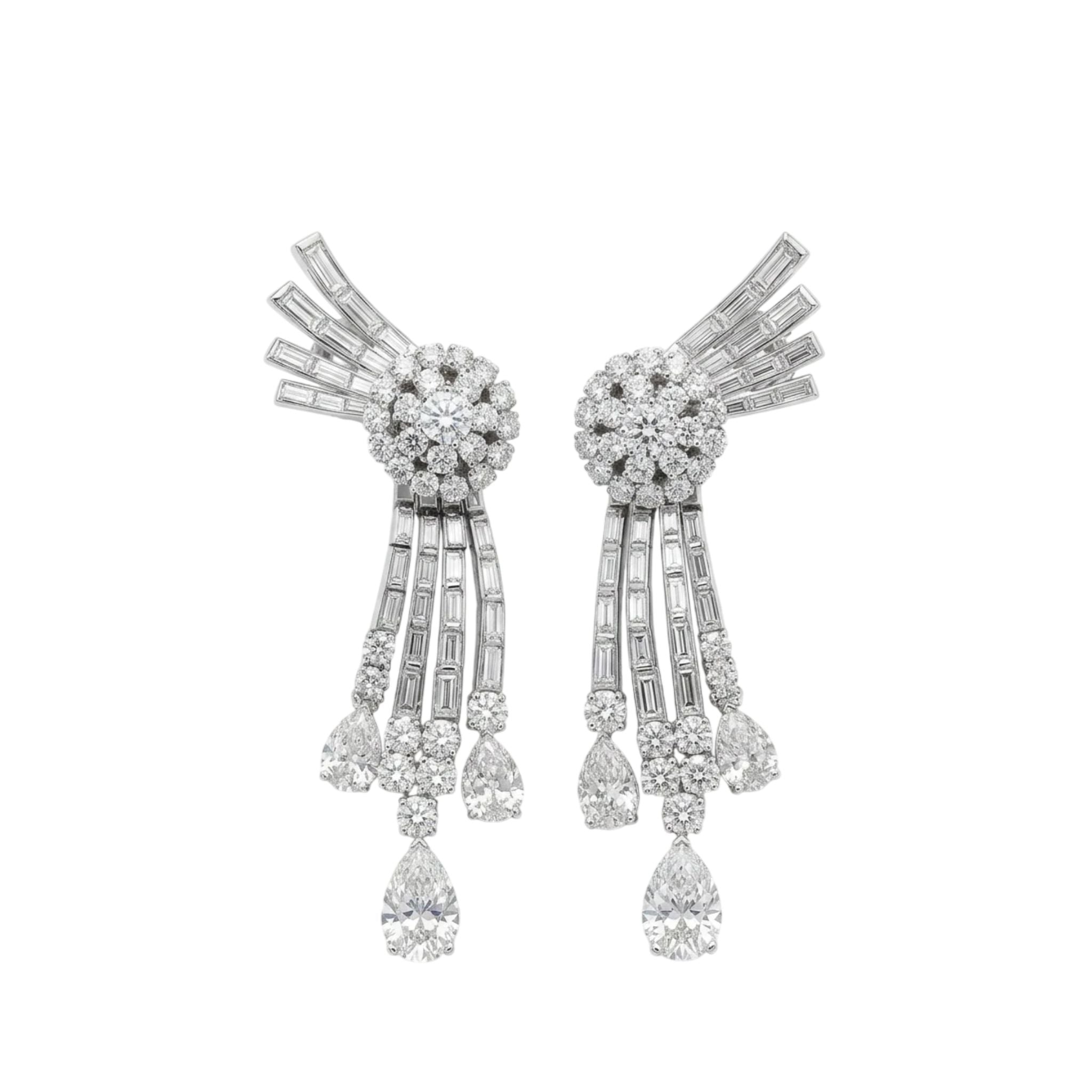 A pair of Diamond Earclips from the 1950s featuring round and baguette diamonds in a fan-like platinum design, with cascading tiers ending in teardrop-shaped diamonds.