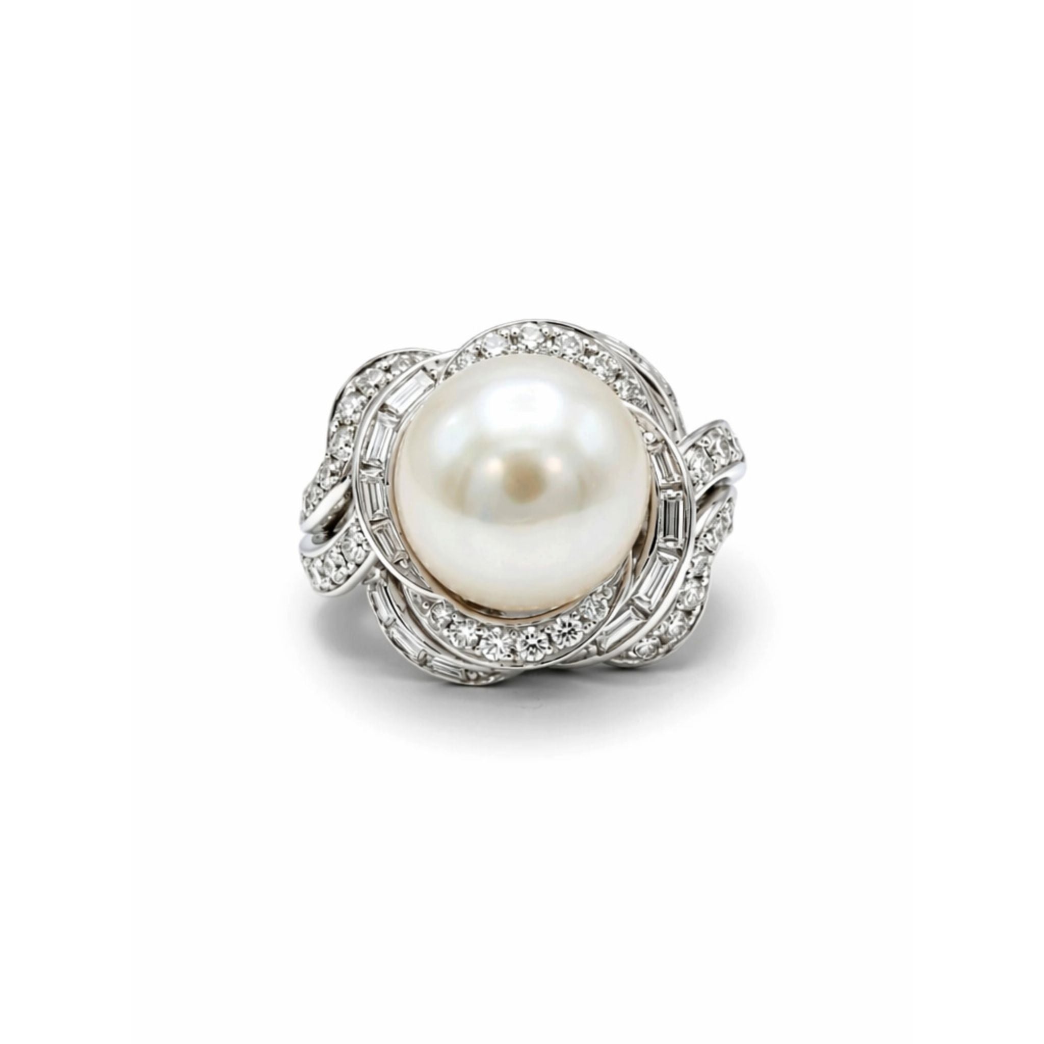 The David Webb Pearl and Diamond Ring showcases a large round cultured pearl at the center, encircled by an intricate silver setting adorned with sparkling diamond accents.
