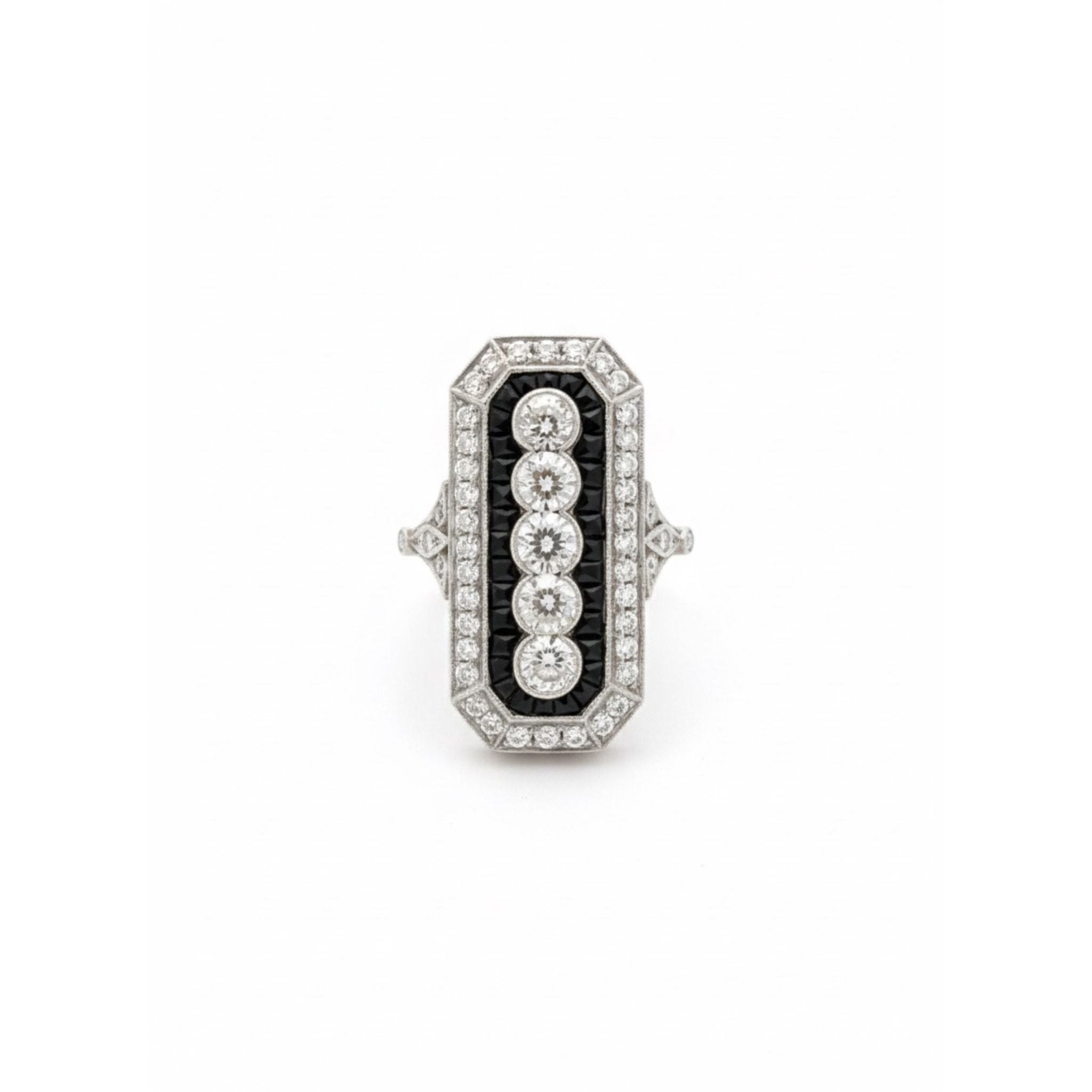 The Onyx and Diamond Ring features an elongated octagonal Art Deco design in platinum, with a black enamel background, old mine-cut diamonds in a vertical row, smaller diamond accents, and calibré-cut onyx. Circa 1925.