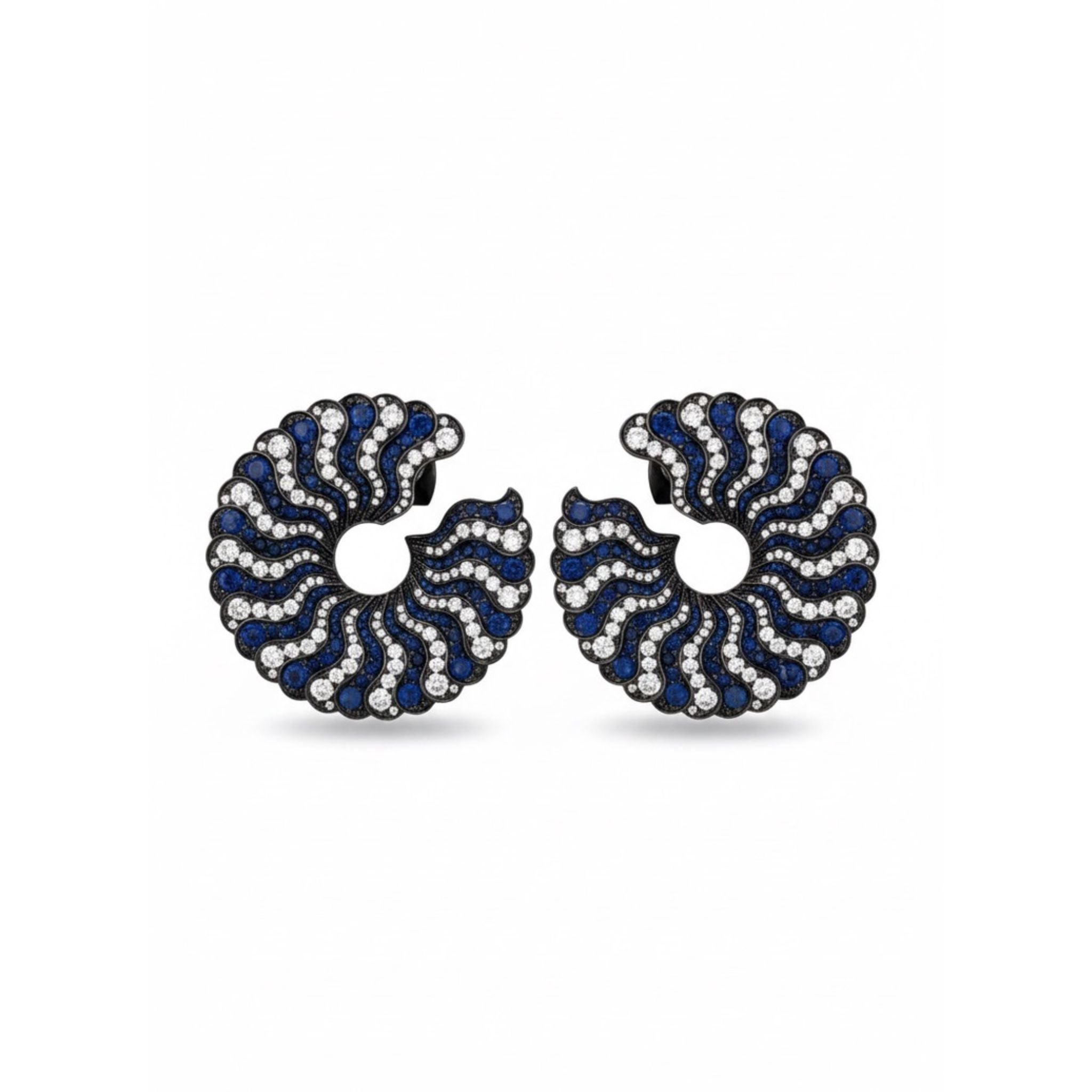 A pair of Sapphire and Diamond Earclips featuring a C-shaped, wave-like design with alternating rows of sapphires and diamonds set in dark metal.