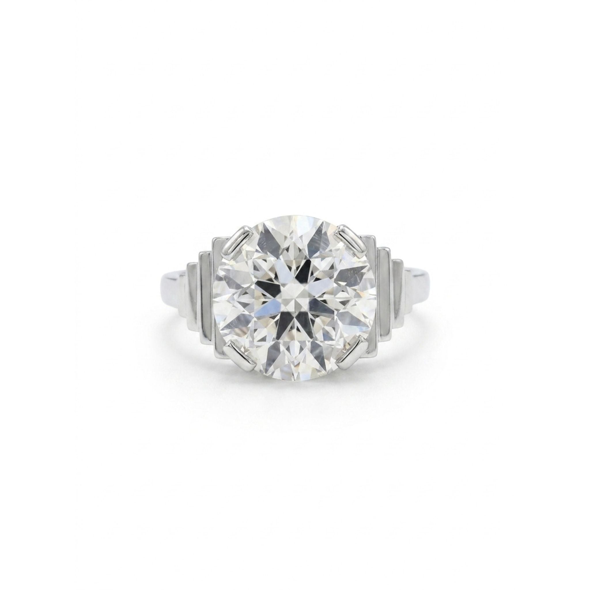 The Platinum and Diamond Ring features a 4.17 carat old European-cut diamond held by four prongs, with stepped geometric accents on each side of the platinum band.