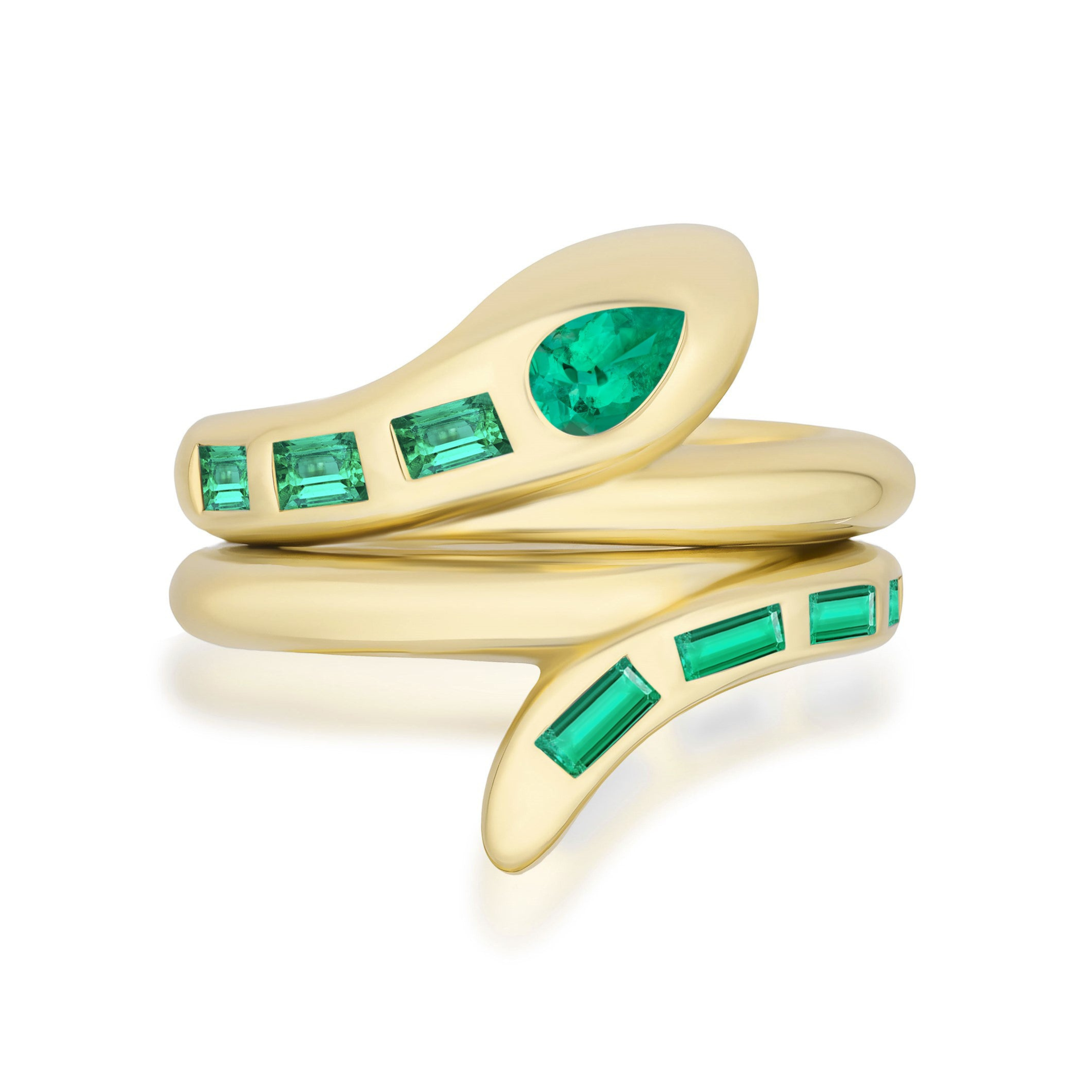 The Serpent Bookend Ring in yellow gold showcases baguette emeralds along the band and a pear-shaped emerald at the head, all coiled in an elegant modern design.