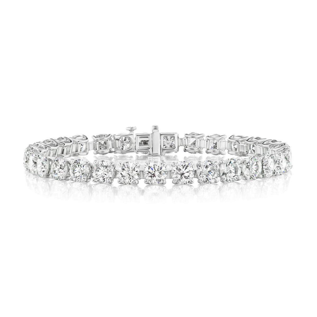 A close-up of the Round Brilliant Diamond Tennis Bracelet, set in 18K yellow gold, featuring a row of round brilliant diamonds linked by a secure clasp.