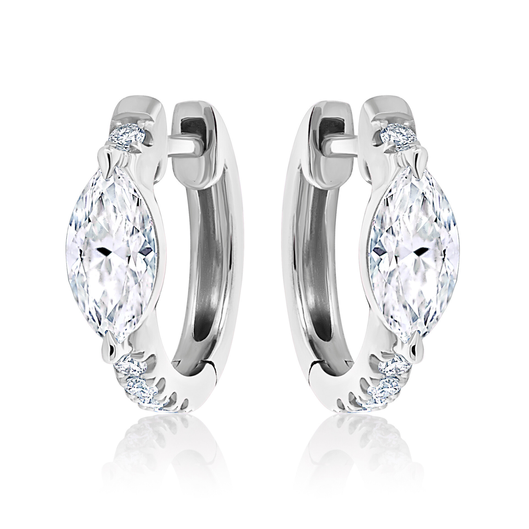 The Pavé Huggies with Marquise Shape Diamond are silver hoop earrings featuring large marquise-shaped diamond-like stones at the center, accented by small round stones on each side, and displayed on a white background.