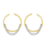 The Coil Draped Hoop Earrings in yellow gold and platinum feature clusters of sparkling white gemstones along the lower curve, shown against a white background.