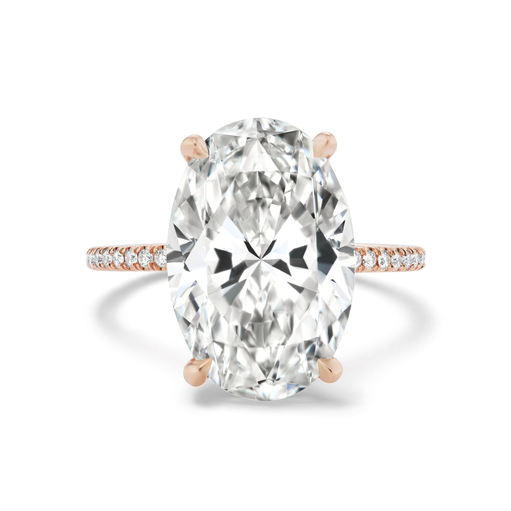 The Oval Diamond Engagement Ring Pavé Band showcases an oval diamond in four prongs, accented by pavé-set round diamonds along a refined 18K Rose Gold band.