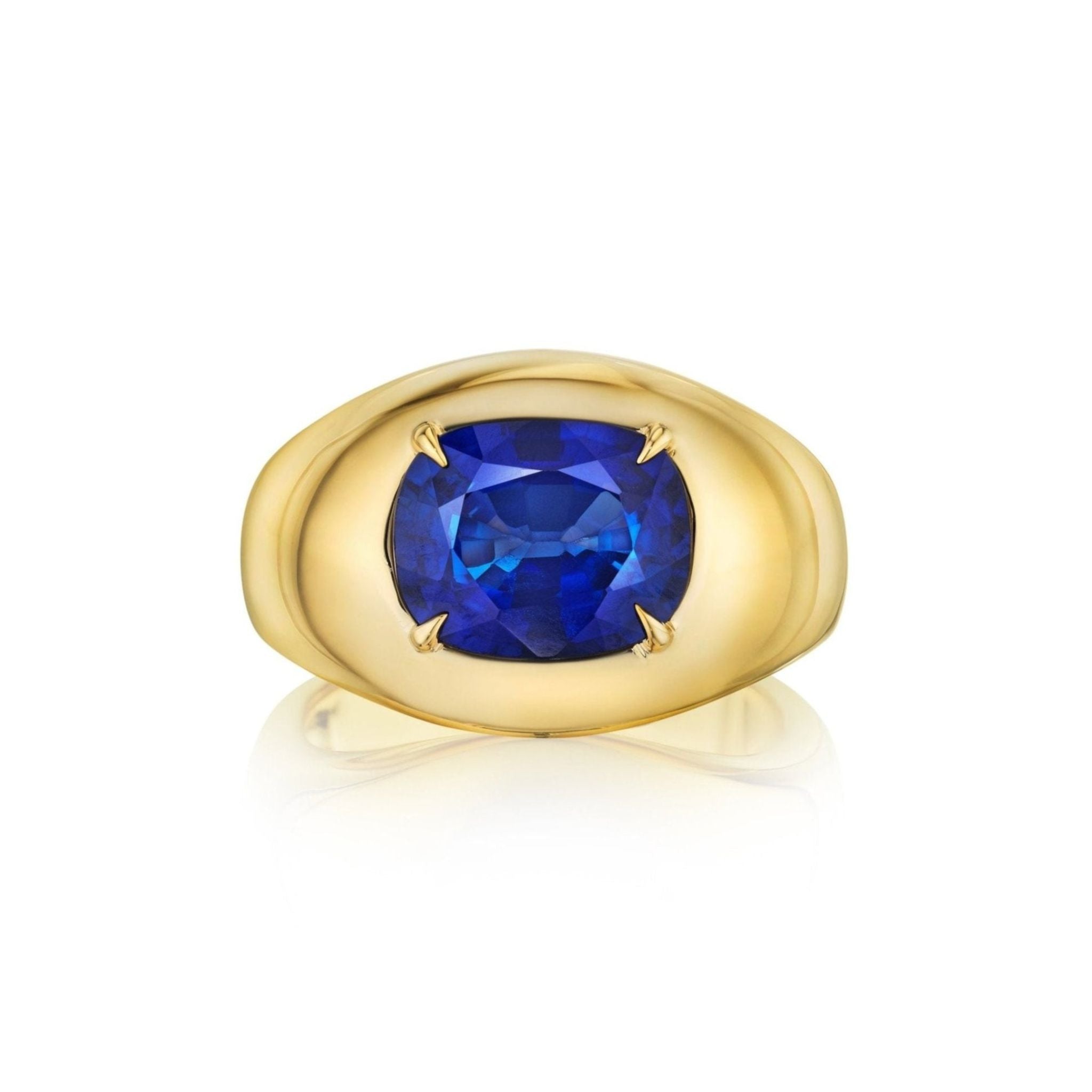 The Oval Gemstone Bombé Ring in yellow gold features a wide band with a bold center-set blue sapphire, creating a striking look.