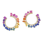 The Chroma Pavé Front-to-Back Hoops feature mixed shape sapphires in a purple, pink, yellow, and blue gradient set in 18K yellow gold, accented with diamond pavé for added sparkle.