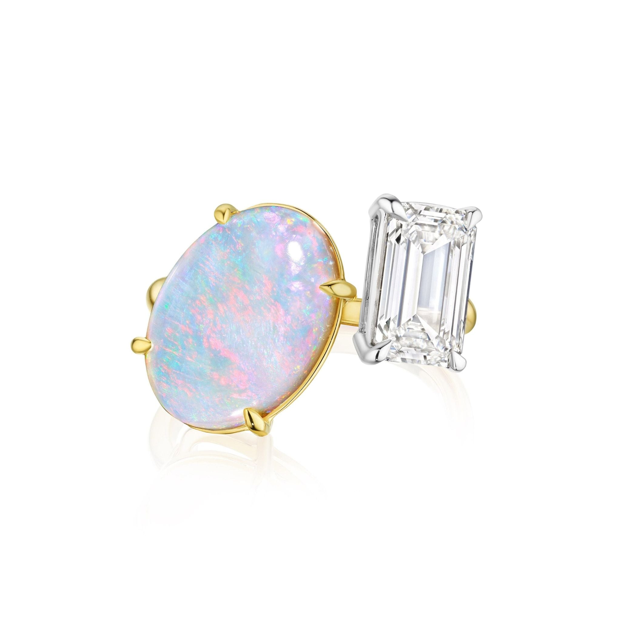 The Toi et Moi Opal and Diamond Ring in Yellow Gold features an oval opal and an emerald-cut diamond set side by side, shown against a white background.
