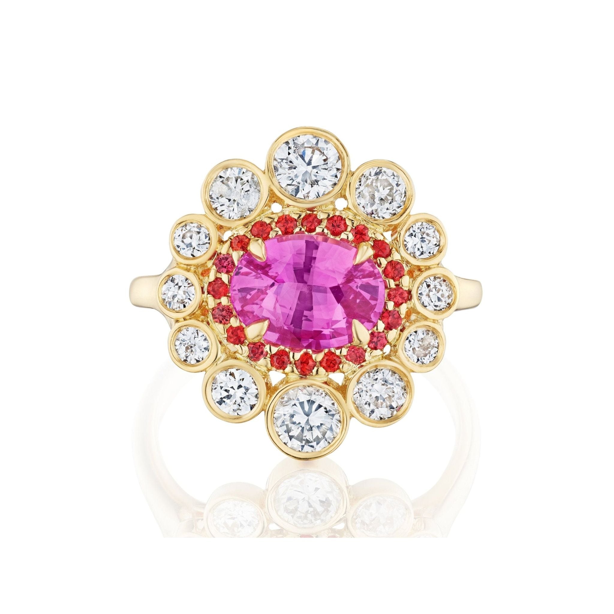 The Cocktail Ring in Yellow Gold features an east-west set oval pink sapphire, encircled by hot pink sapphires and a floral halo of round white diamonds, all set in elegant 18K yellow gold.