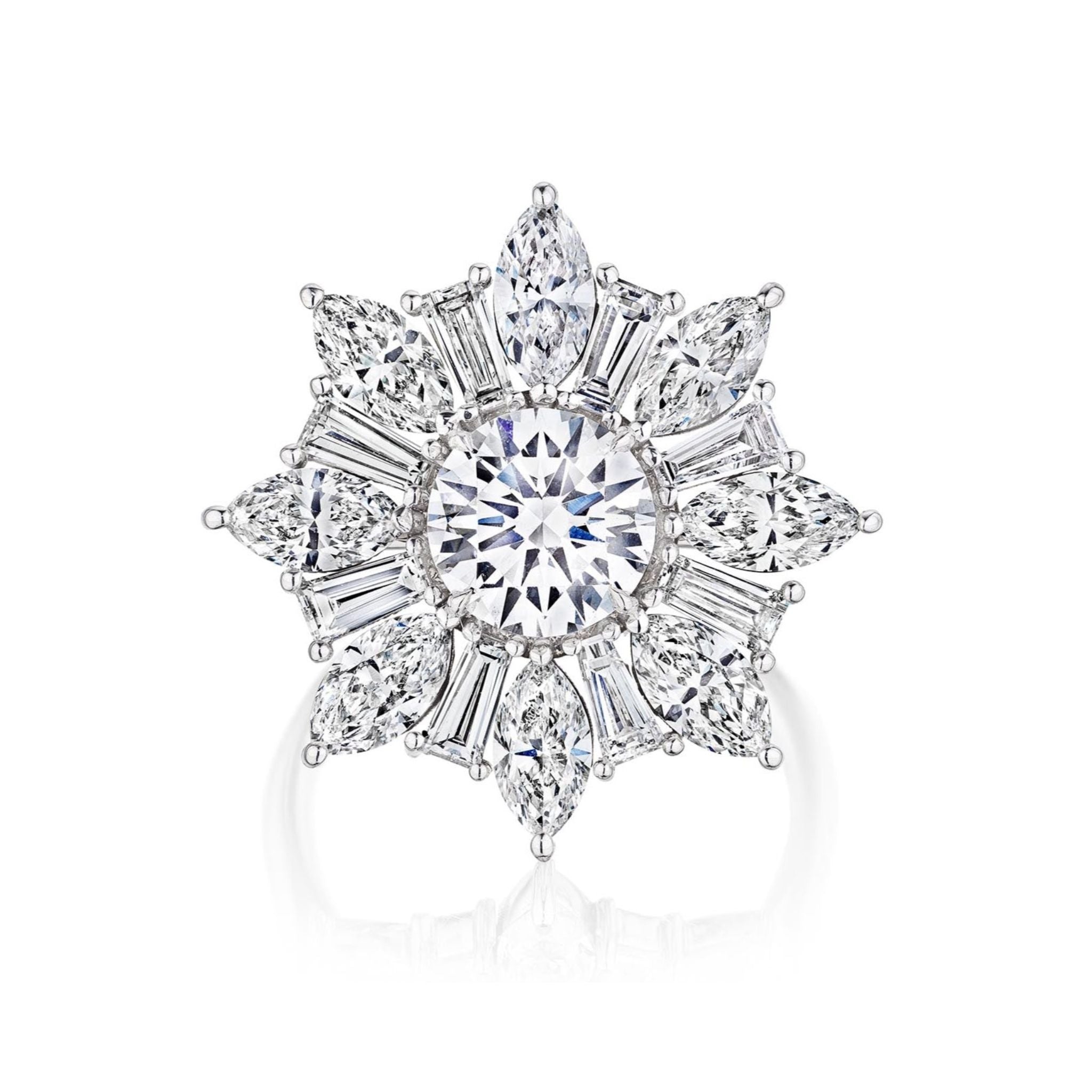 The Cocktail Ring in White Gold with Mixed Shape Diamonds features a large round diamond center, surrounded by marquise, tapered baguette, and pear-shaped diamonds in a starburst floral design on stunning 18K white gold.