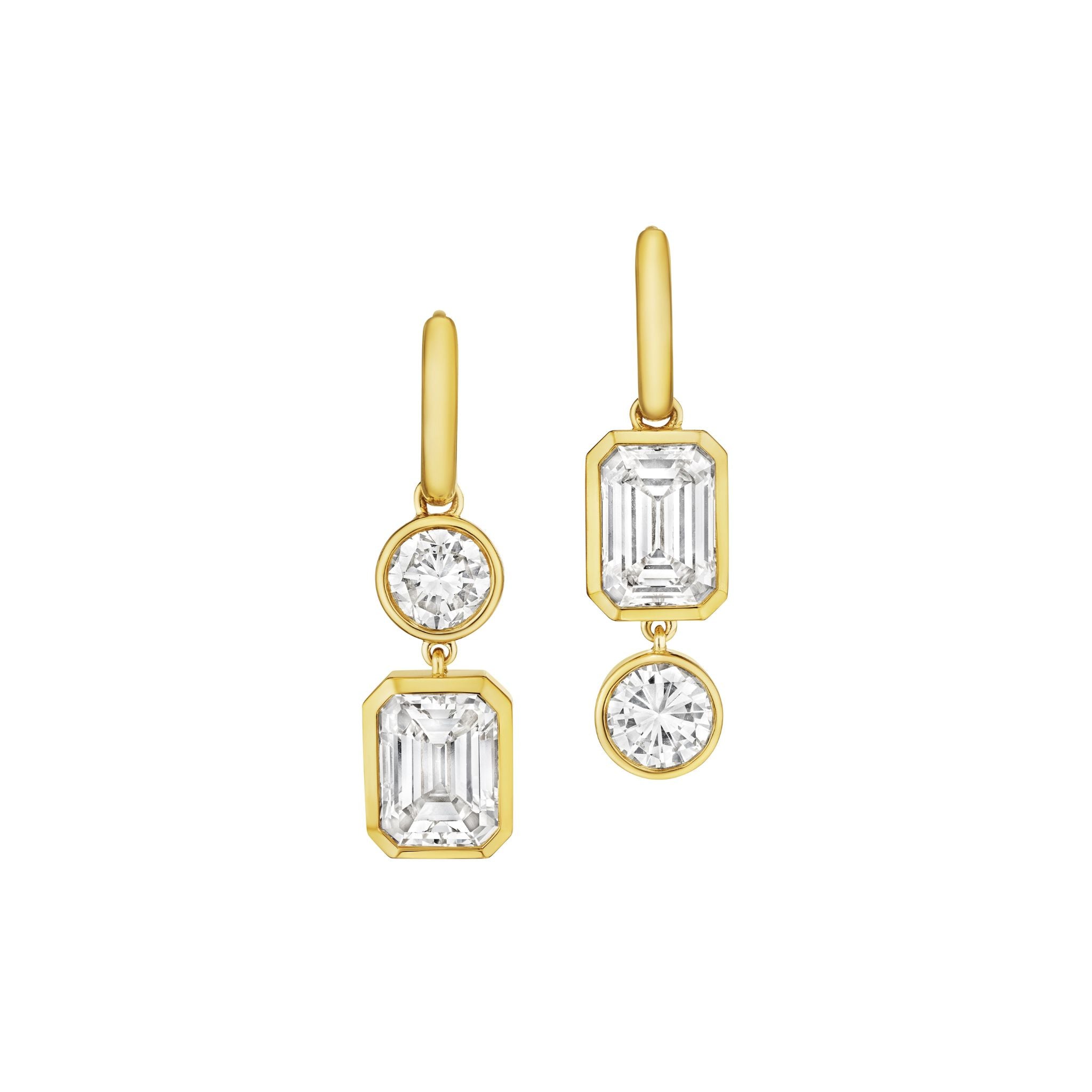 Asymmetrical Drop Earrings with bezel set round and emerald cut diamonds in 18K yellow gold, shown on a plain white background.