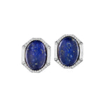 The Oval Lapis Lazuli Studs feature large oval Lapis Lazuli stones in silver octagonal frames, accented with elongated baguette diamonds and refined diamond pavé.