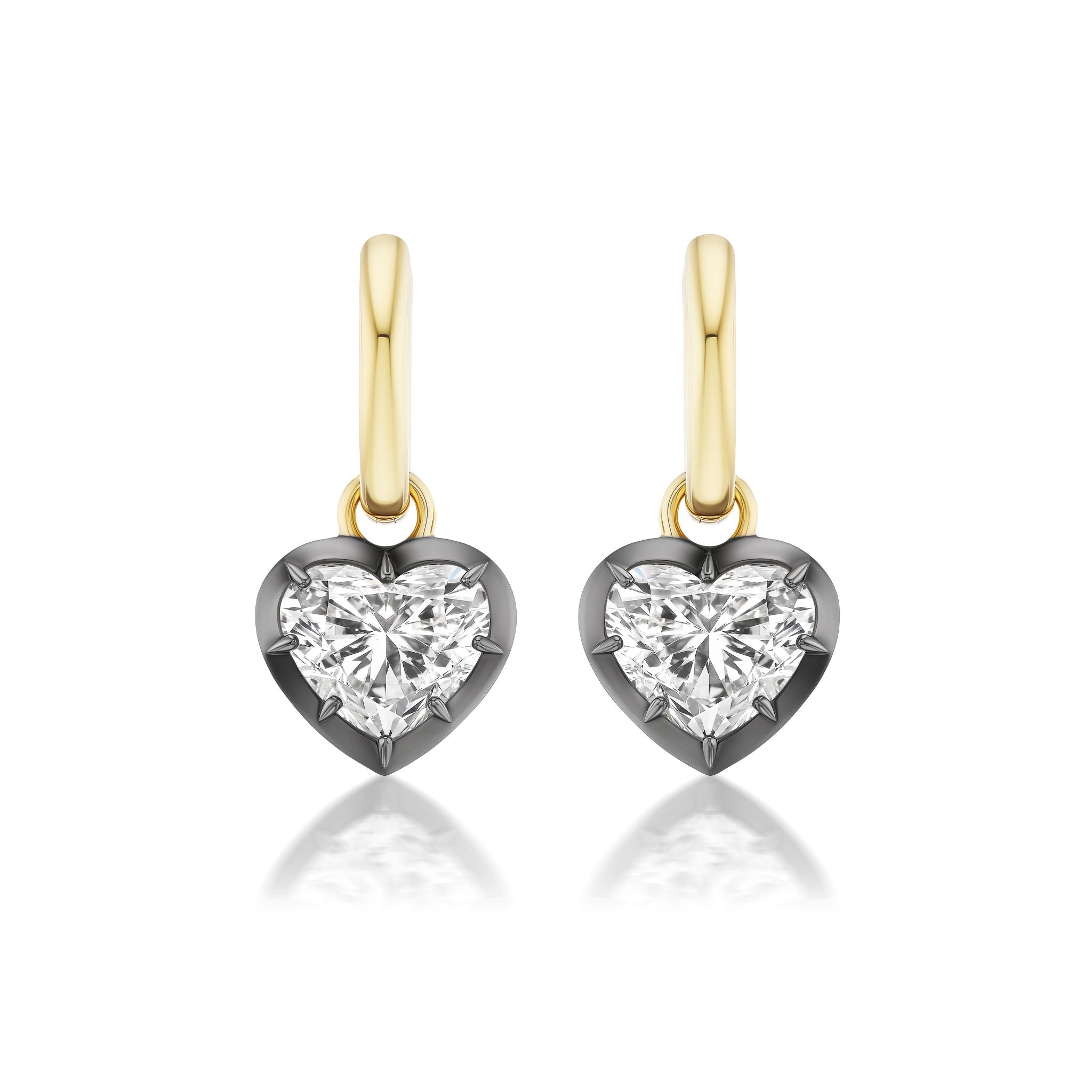 Collet Set Heart Shape Earrings with diamond-like gemstones, set in black rhodium and yellow gold, displayed on a white background.