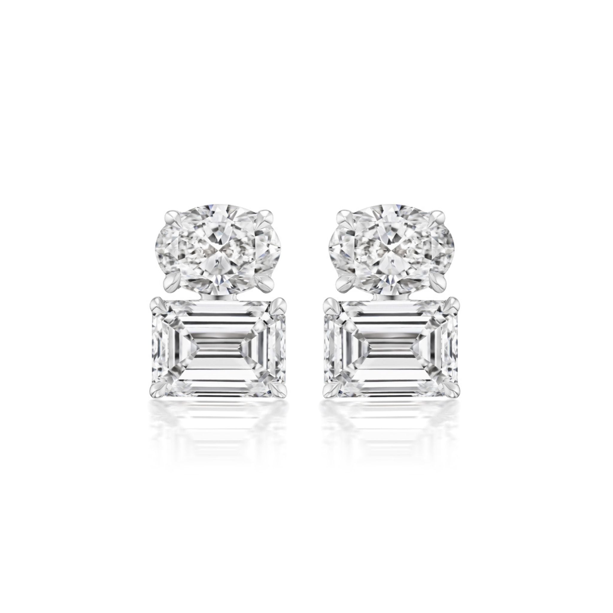 The Large Oval and Emerald Cut Diamond Earring features oval-cut diamonds atop emerald-cut diamonds set in white metal, displayed against a white background.