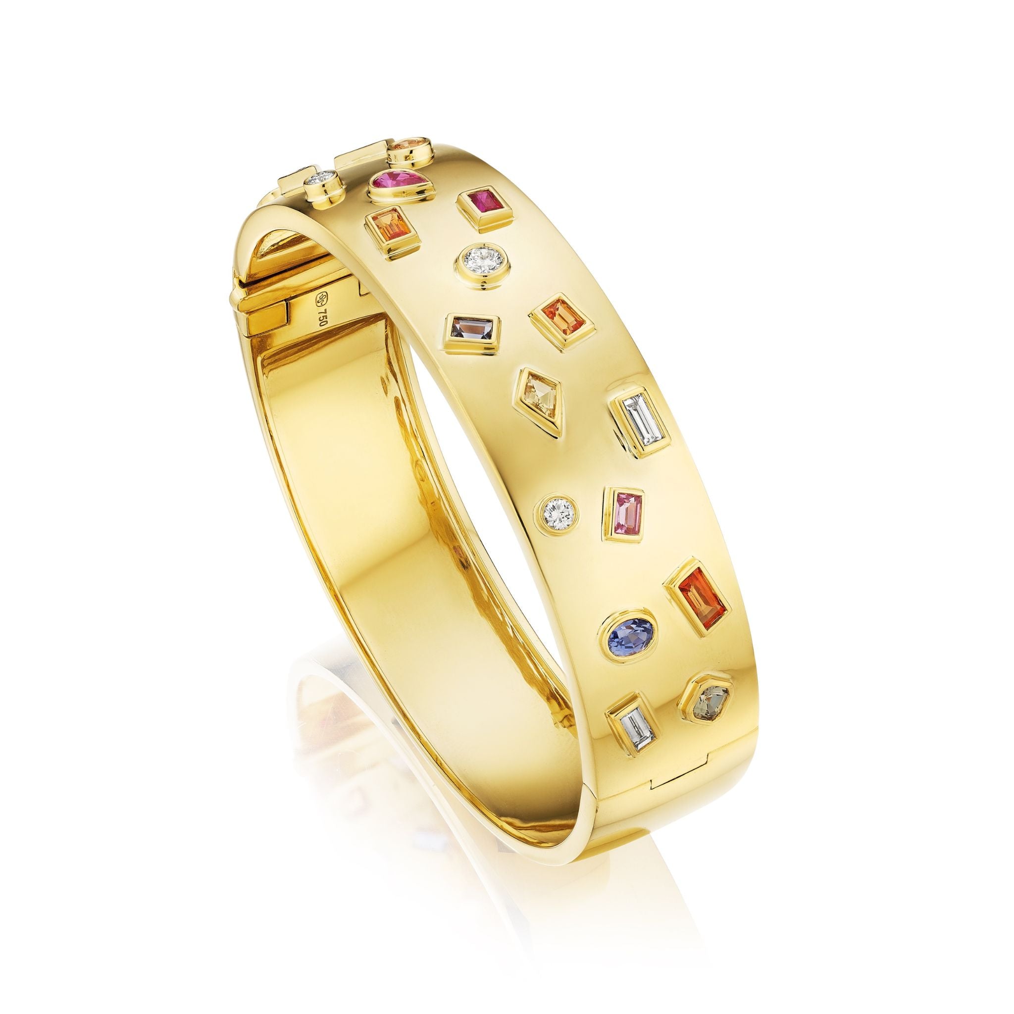 The Bespoke Bezel Set Multi Shape Mixed Stone Bangle in Yellow Gold showcases multi-colored, geometric stones set in a polished yellow gold band, displayed on a white background.
