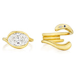 One gold ring is a double band in 18k yellow gold with a large oval diamond, while the other is an Asymmetrical Wave Ring Jacket in yellow gold accented with small diamonds and blue birthstones.