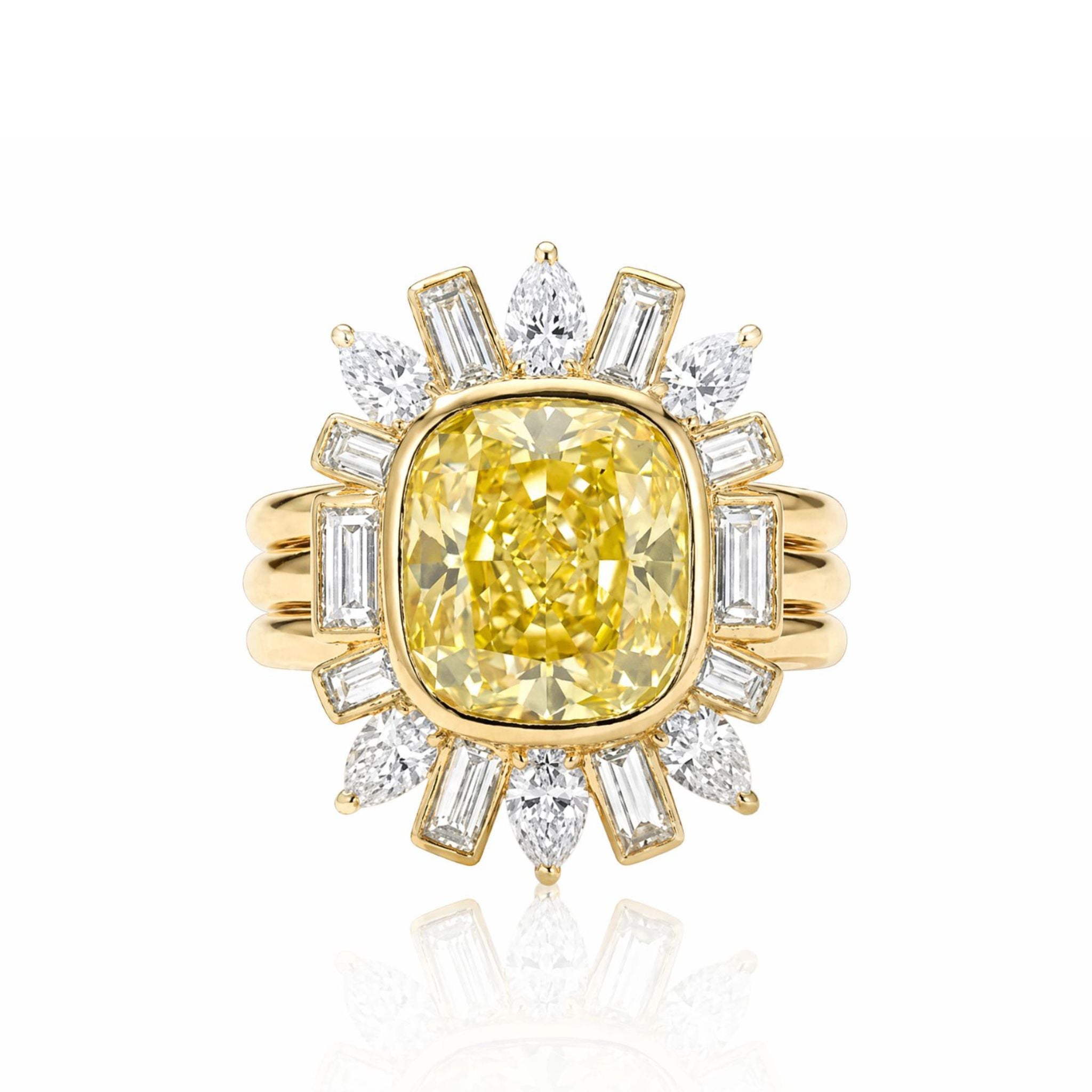 Showcasing a cushion cut yellow diamond bezel set at the center, this ring jacket dazzles with pear and emerald cut side stones—an eye-catching piece designed to beautifully enhance your favorite ring.