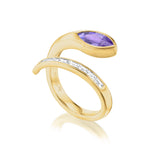 The Snake Wraparound Ring features a modern open design with a purple marquise sapphire on one end and baguette diamonds on the other, all crafted in 18K yellow gold and displayed against a white background.