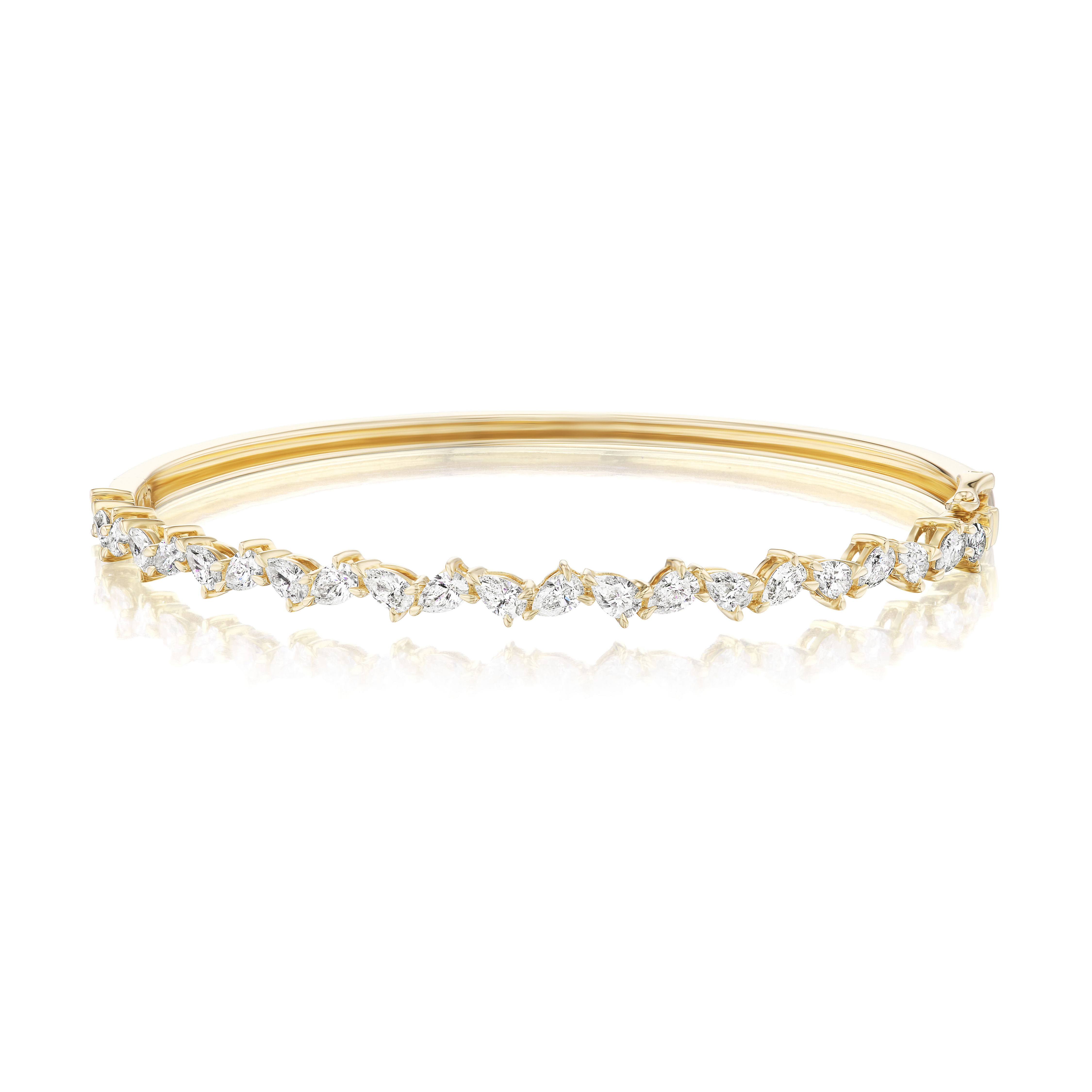 The Alternating Pear Shape Diamond Bangle in Yellow Gold features sparkling G-H color white diamonds in a marquise pattern atop a smooth 18k yellow gold band with a hinged clasp.
