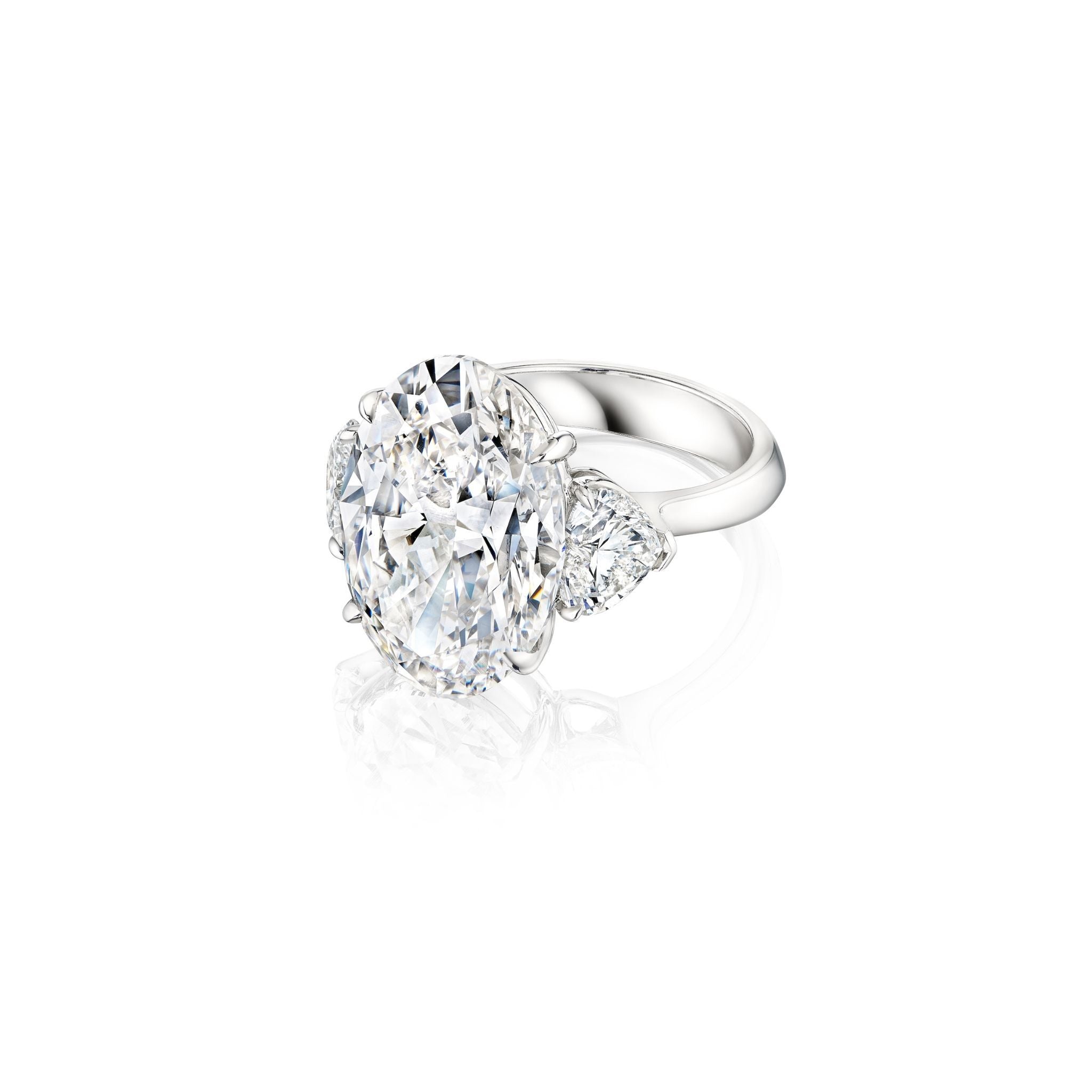 The Oval Diamond Engagement Ring with Heart Shape Side Stones is shown on a white background, featuring a platinum band with an oval diamond center and heart shape diamonds on each side.