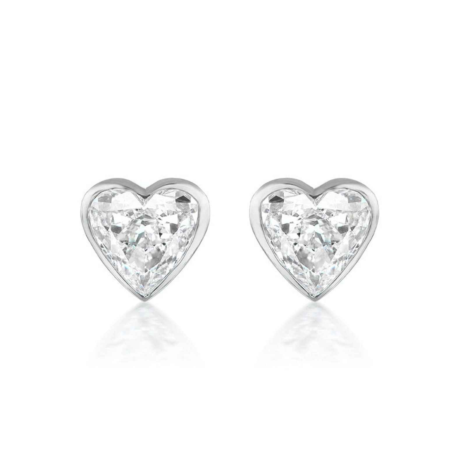 Bezel Set Diamond Heart Studs in White Gold featuring two sparkling heart-shaped diamonds set in 18K white gold, shown against a plain white background.