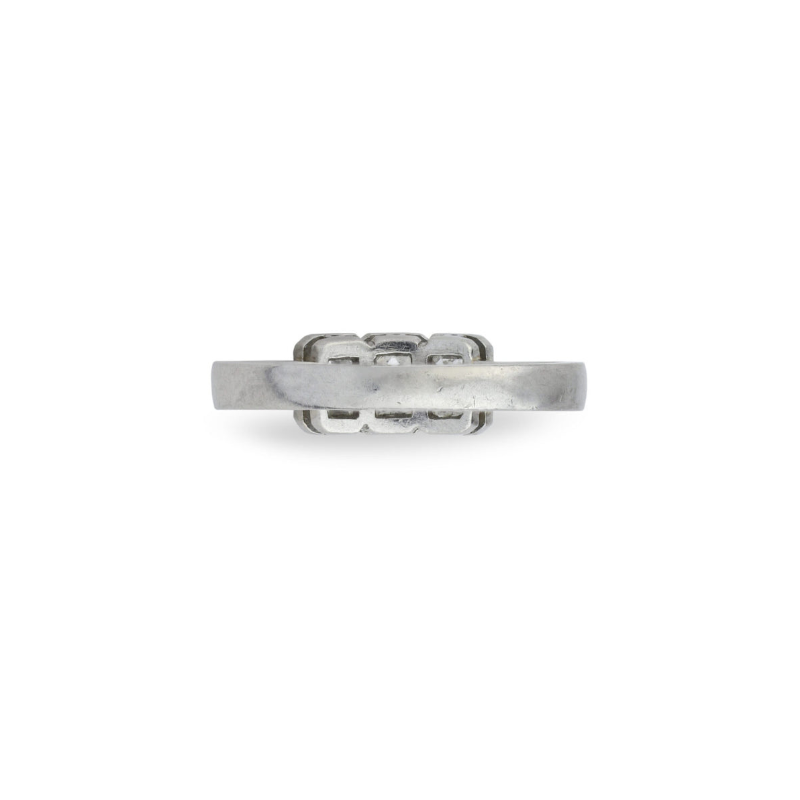 A side-view of the Three-Stone Diamond Ring shows its geometric, rectangular top inspired by 1950s style. The simple silver band accentuates the raised feature, evoking platinum and the look of rectangular diamonds.