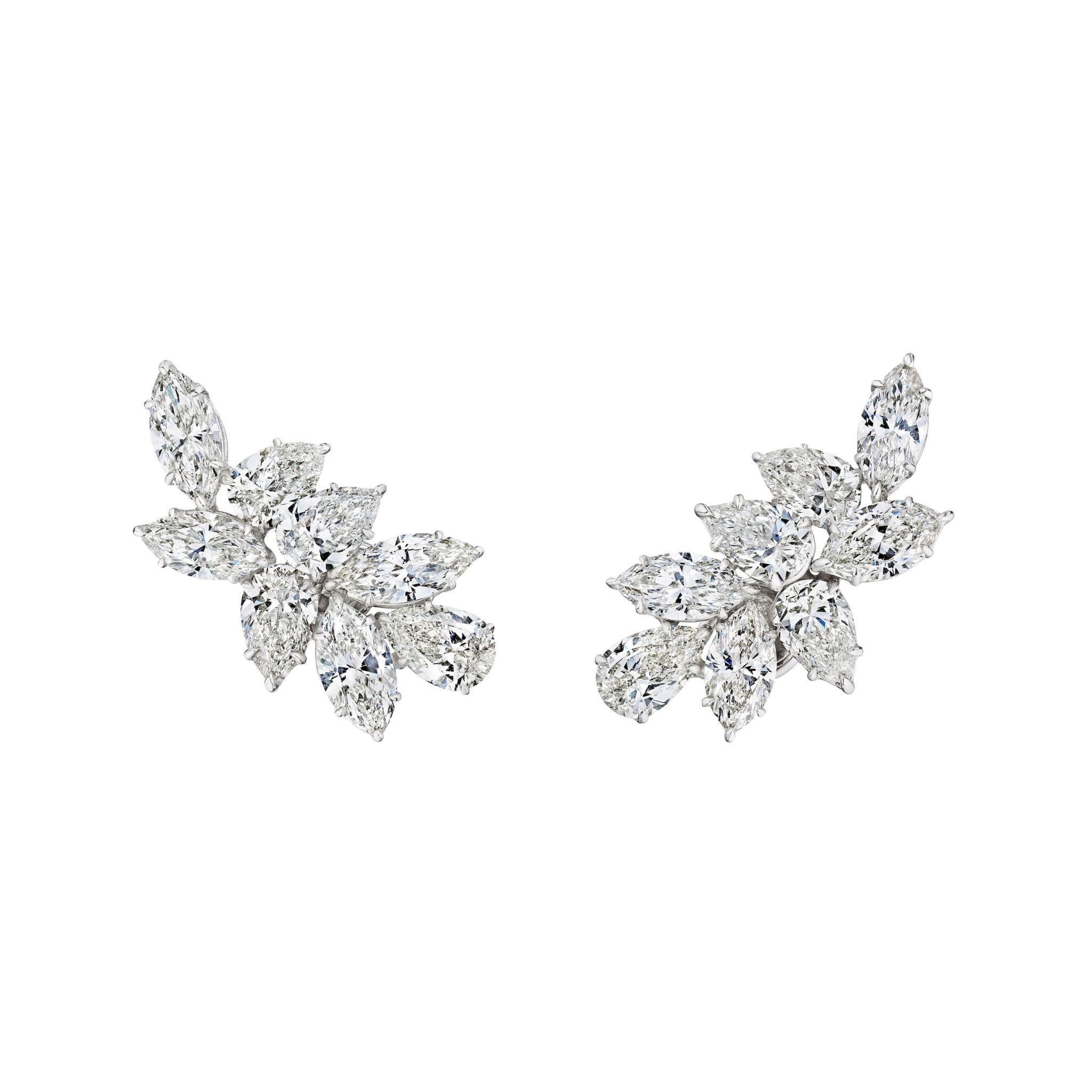 A pair of Diamond Earclips crafted in 18K white gold, featuring clusters of marquise and pear-shaped diamonds in a floral, leaf-inspired design.