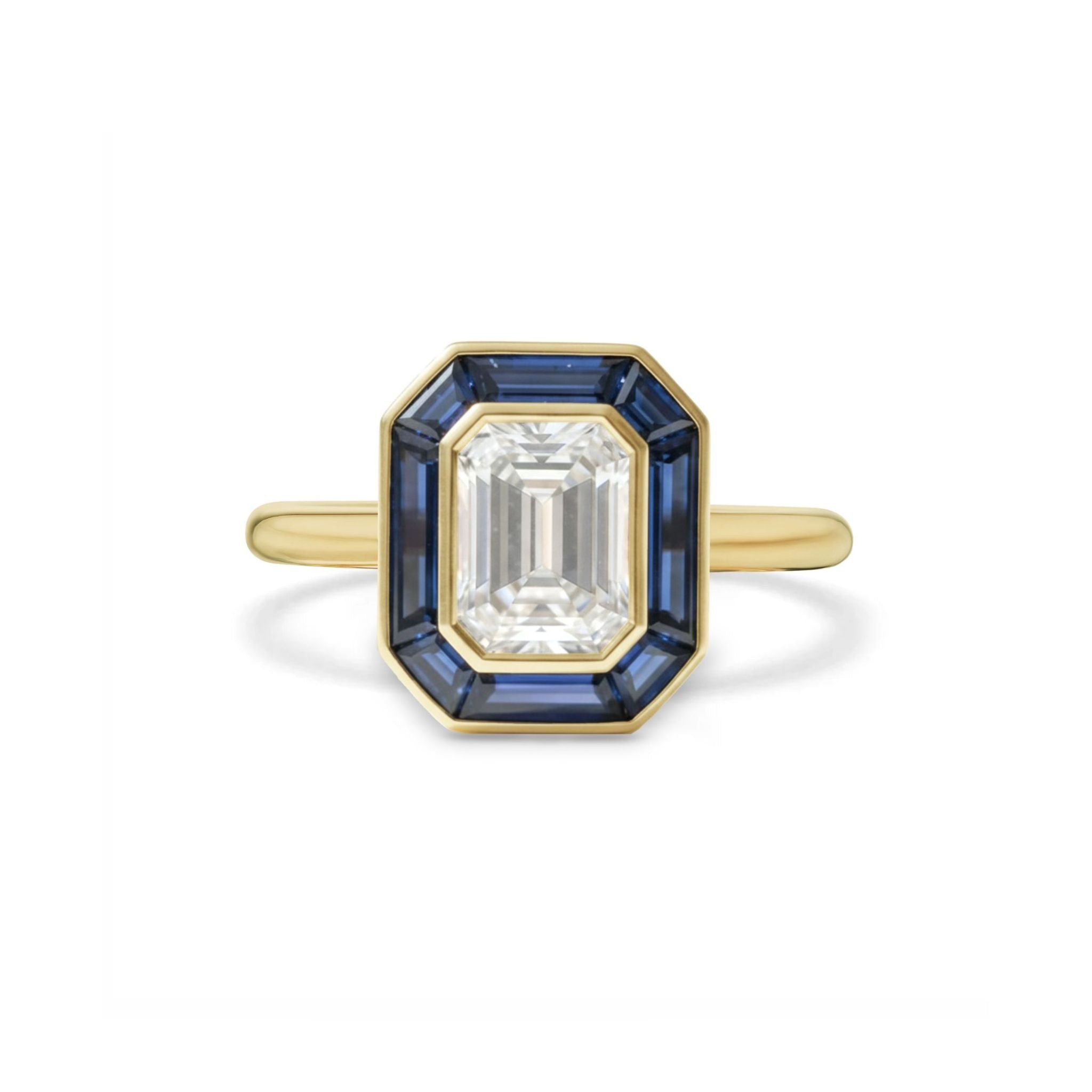 Mosaic Bezel Set Emerald Cut Diamond Engagement Ring with Trapezoid Blue Sapphire Stone Halo in Yellow Gold, displayed on a white background.