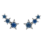 The America250 Trio Star Crawler Earrings in Black Rhodium feature three star-shaped designs with blue gemstones and clear crystals on each earring, handcrafted in New York City for artisan elegance.