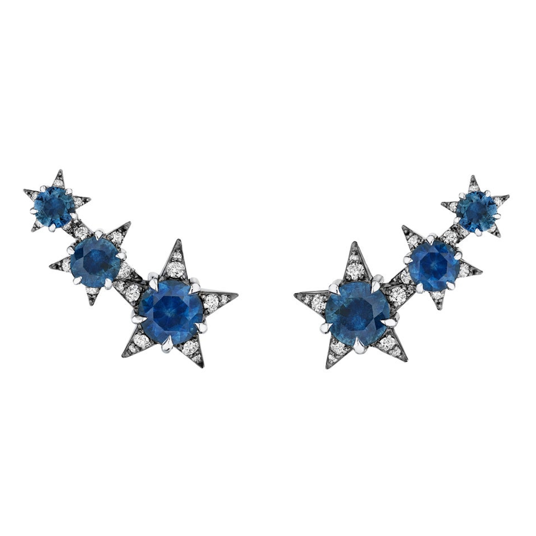 The America250 Trio Star Crawler Earrings in Black Rhodium feature three star-shaped designs with blue gemstones and clear crystals on each earring, handcrafted in New York City for artisan elegance.