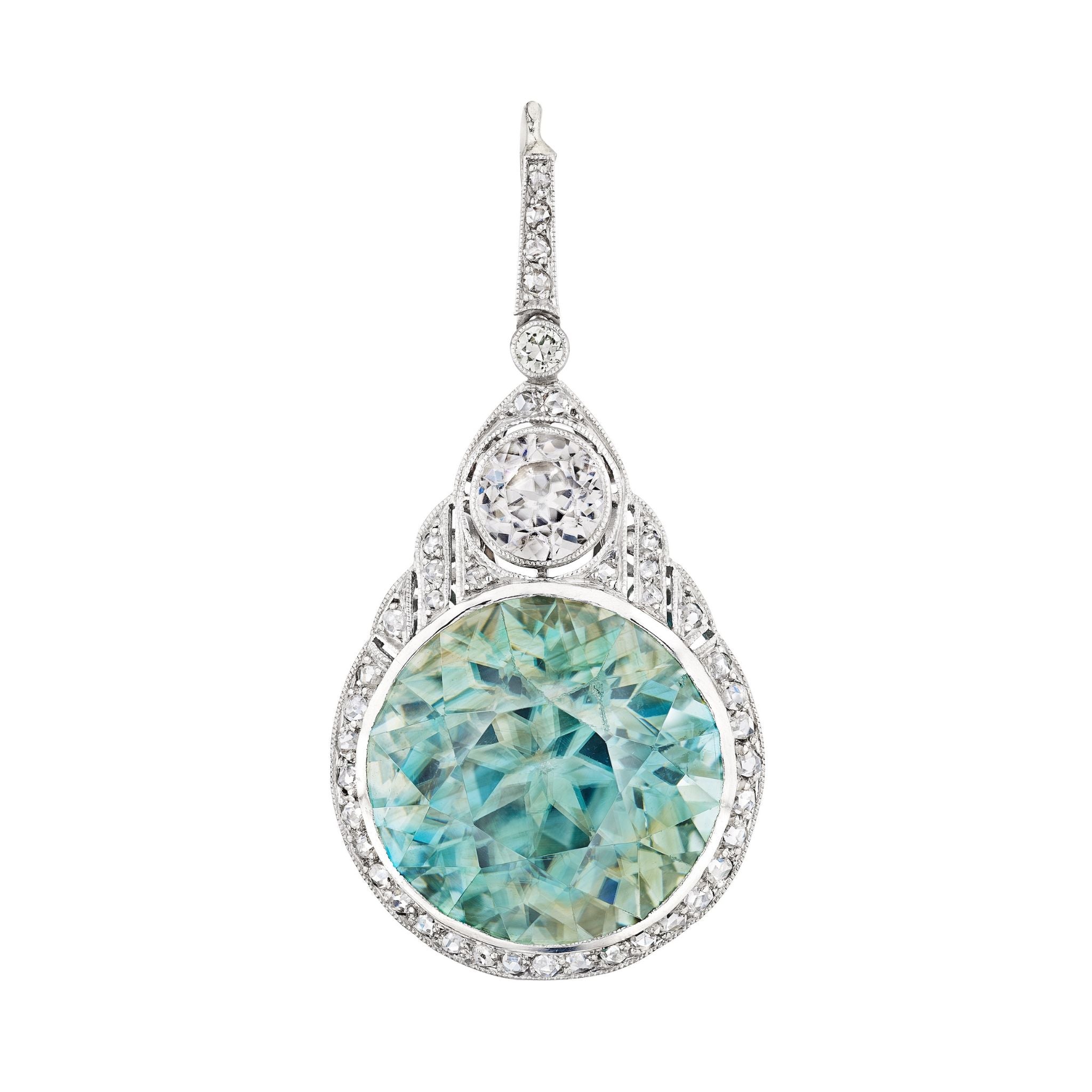 The Zircon and Diamond Pendant showcases a large round pale blue zircon encircled by old-cut diamonds, set in a detailed platinum 1930s-inspired design with a loop for adding your favorite chain.