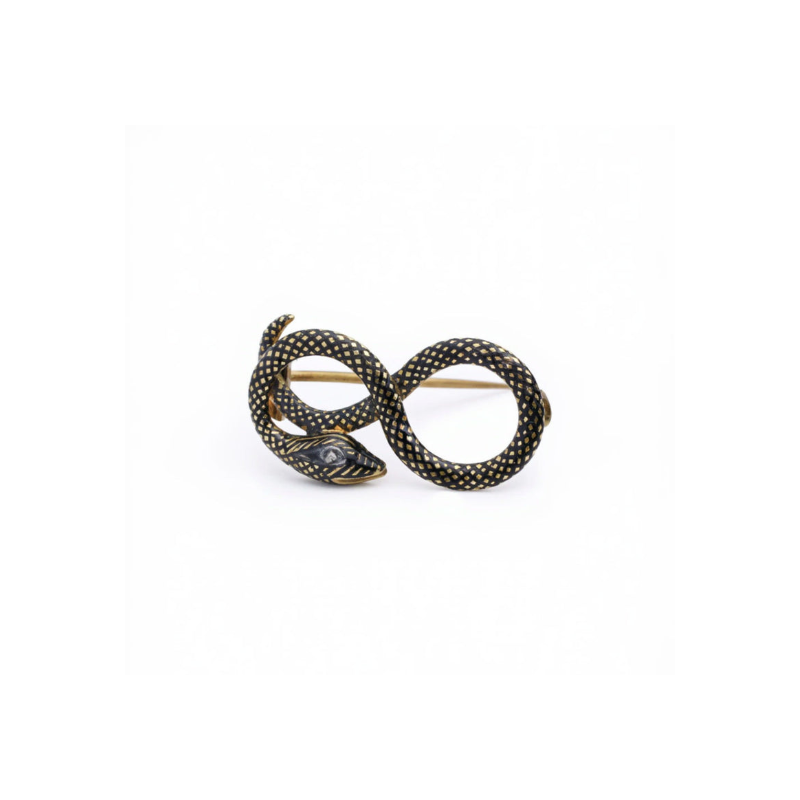 The Antique Diamond and Enamel Snake Pin, featuring a gold and black entwined snake with detailed dotted patterns, is displayed on a plain white background, highlighting its elegant craftsmanship.